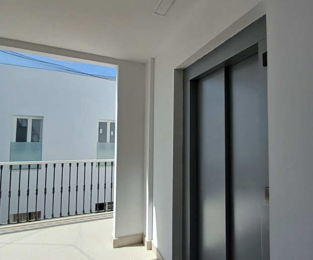 Elevator and balcony hallway