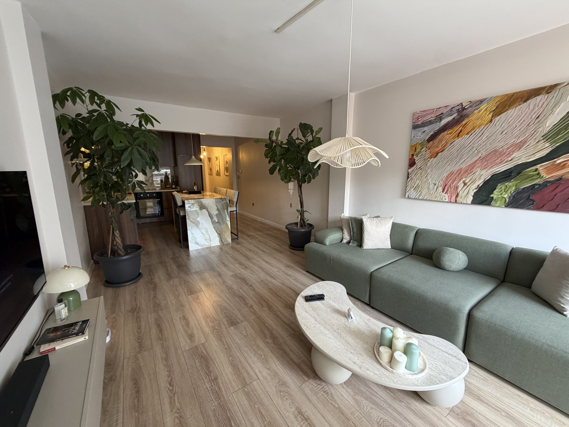 Bright living room with green sofa