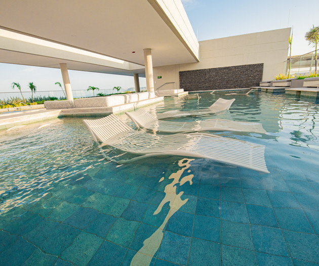 Pool with submerged loungers