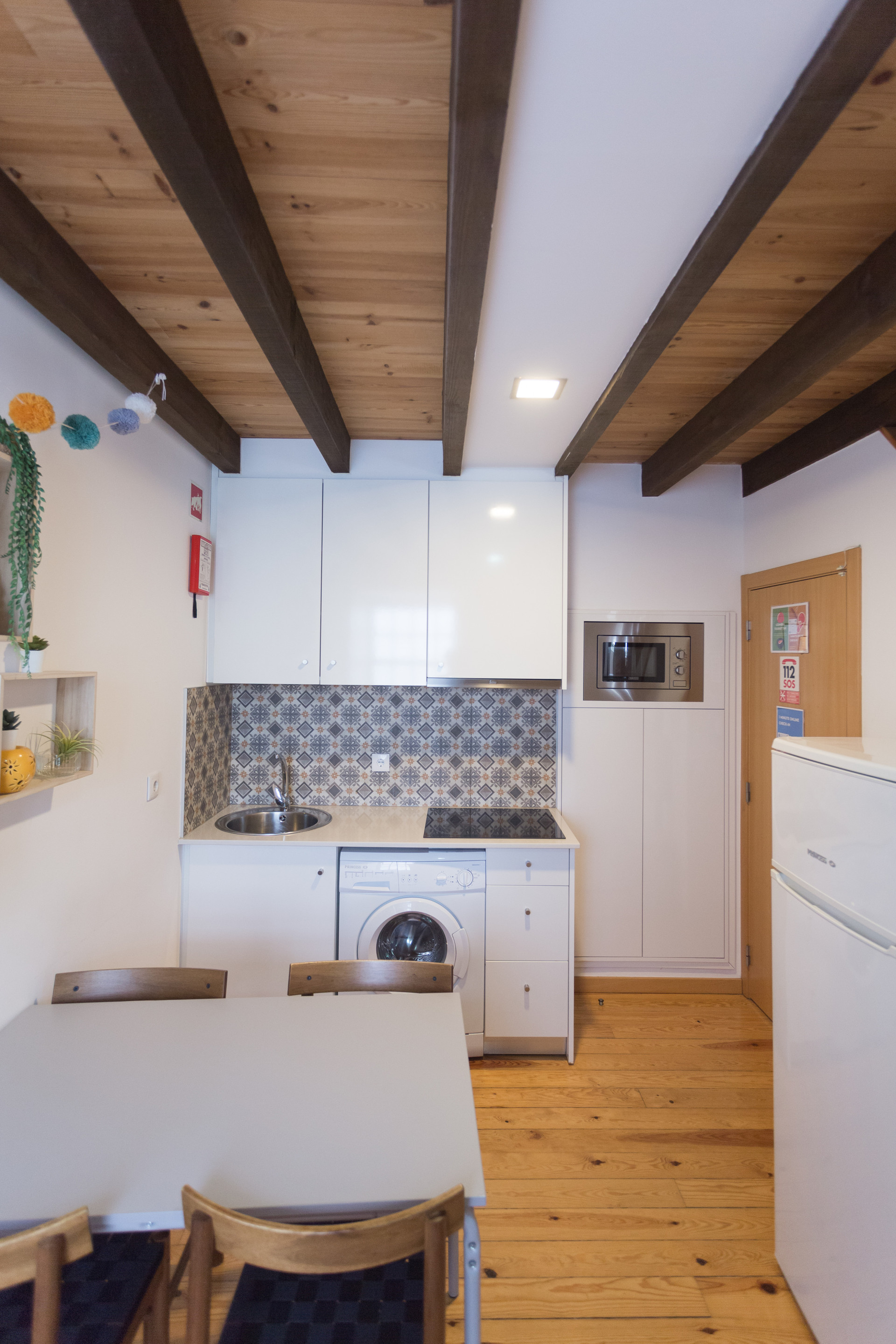 Kitchen with beamed ceiling dining