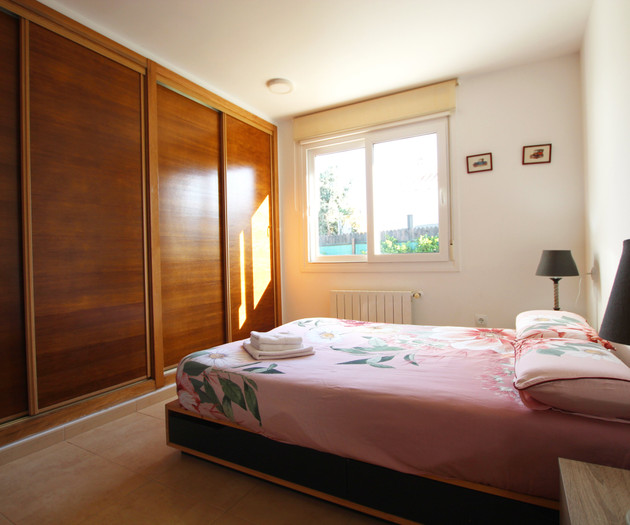 Bedroom with wardrobe and double bed