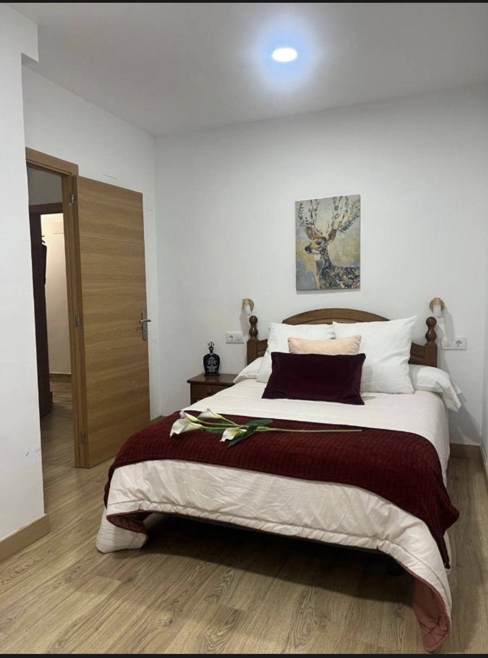 Double bedroom with deer artwork