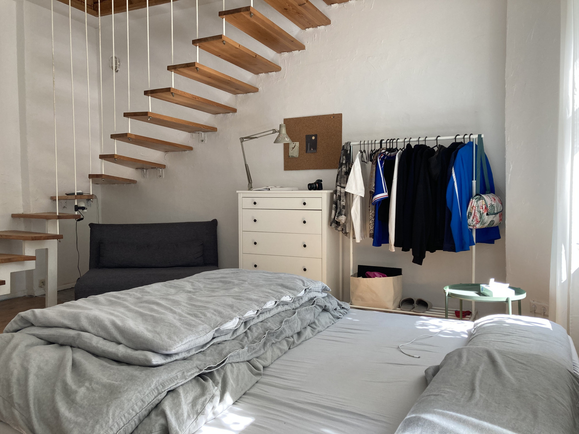 Drawers, hangers, and a small sleeping couch under the stairs!