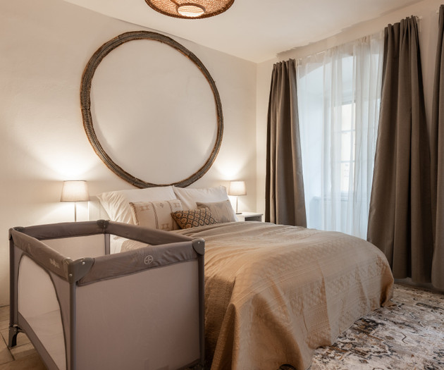 Bedroom with baby crib setup