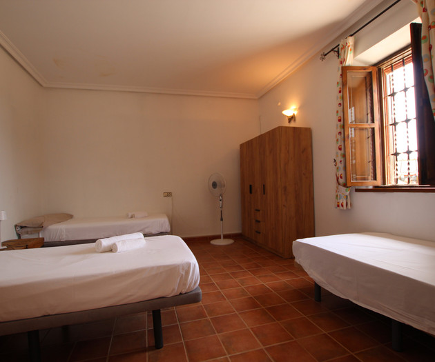 Bedroom with three beds