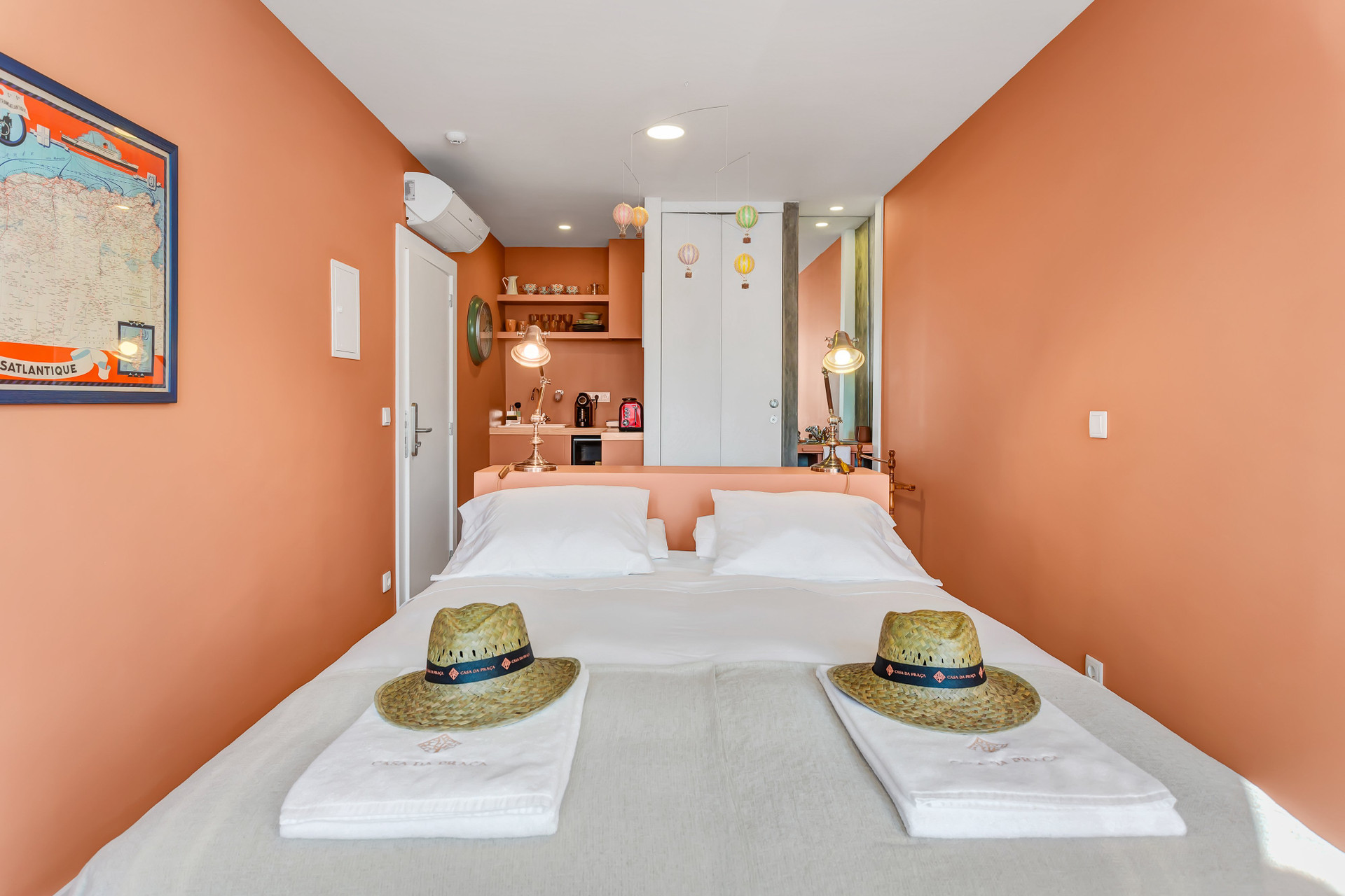 Orange bedroom with kitchenette