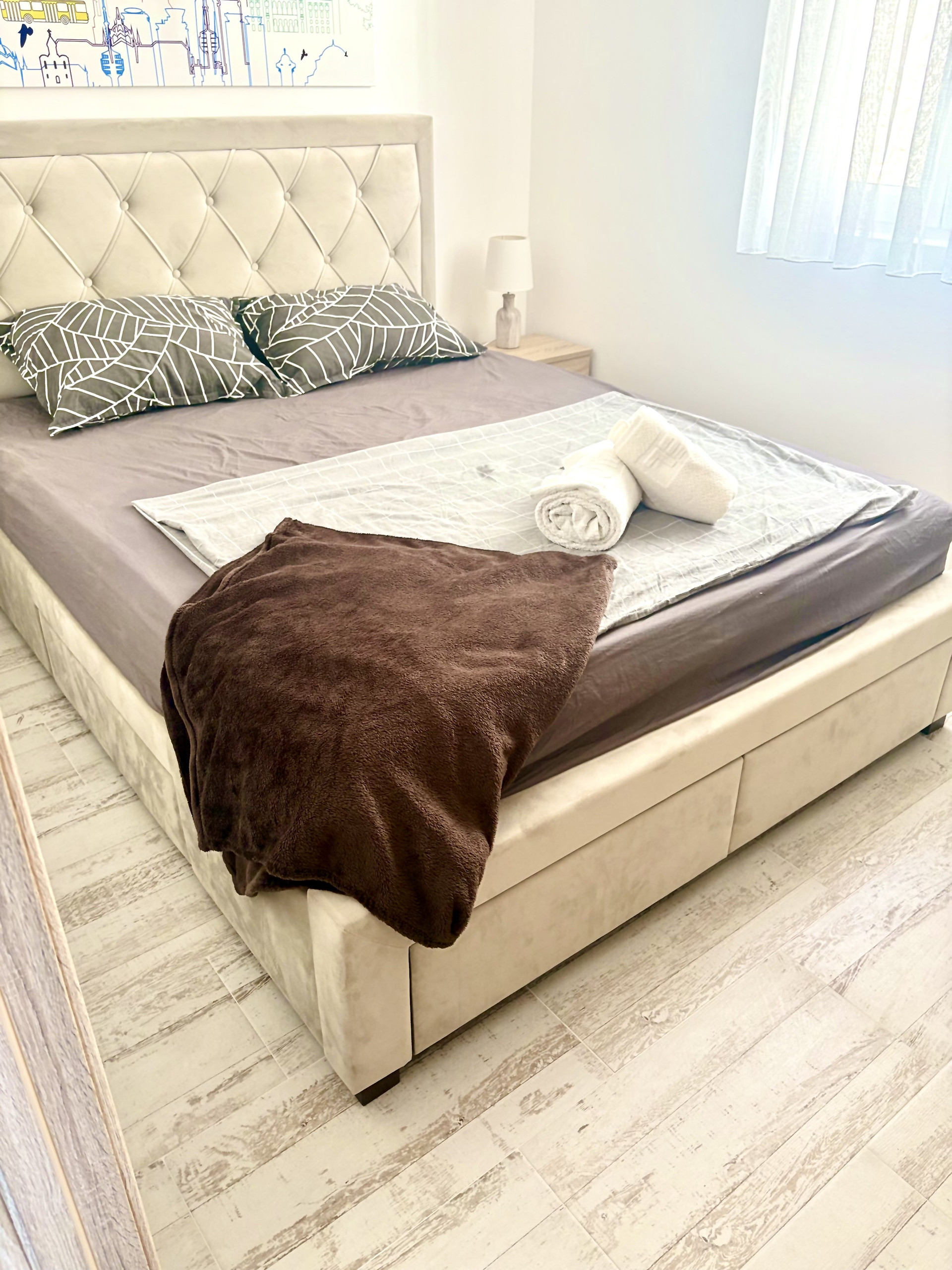 Bedroom with bed and towels