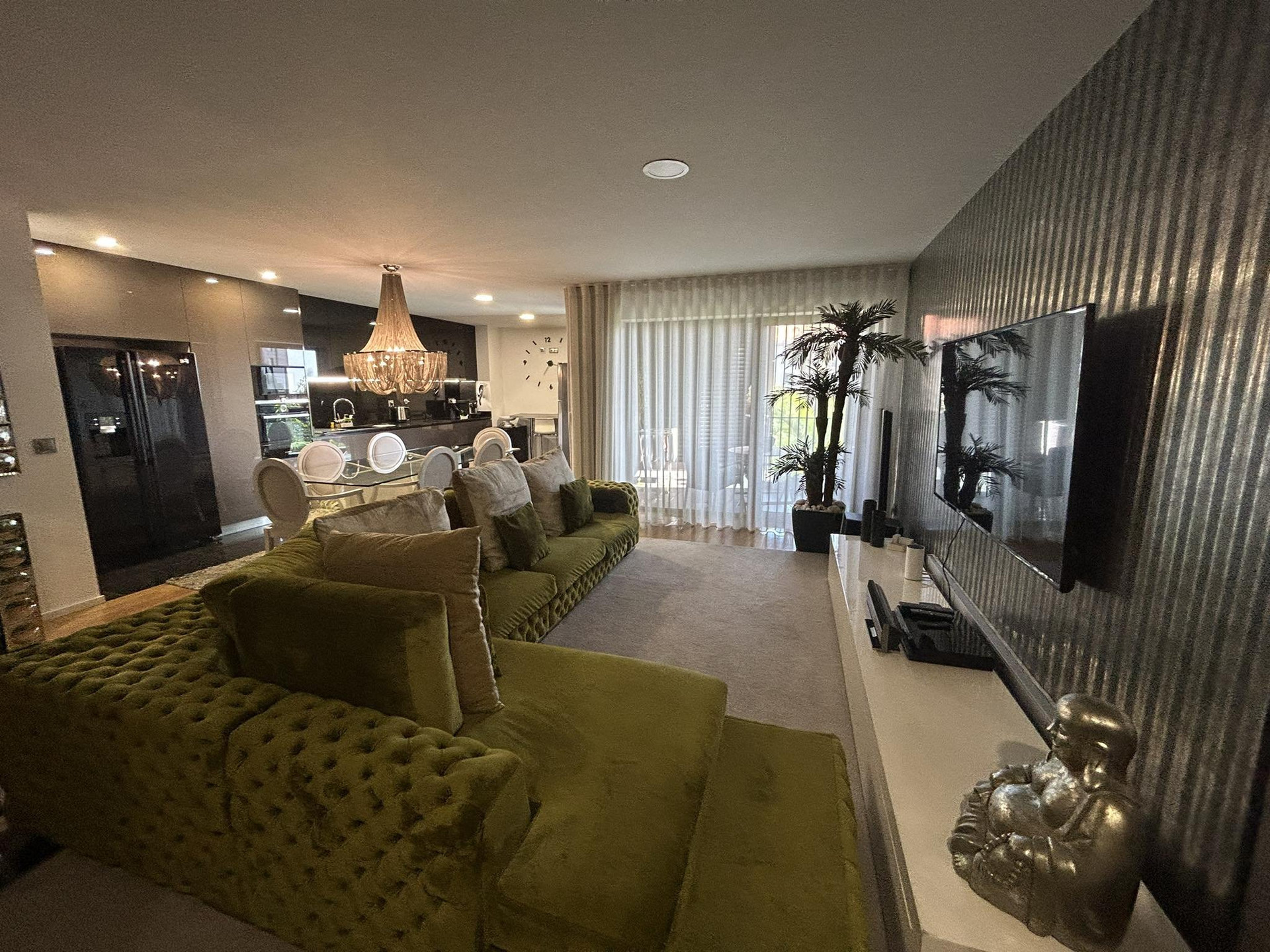 Living room with TV and kitchen