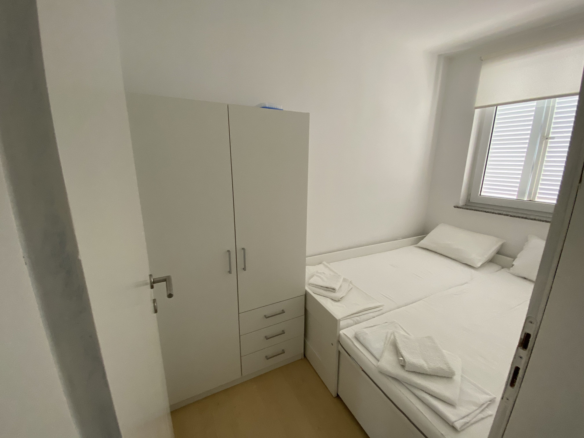 Small bedroom with wardrobe