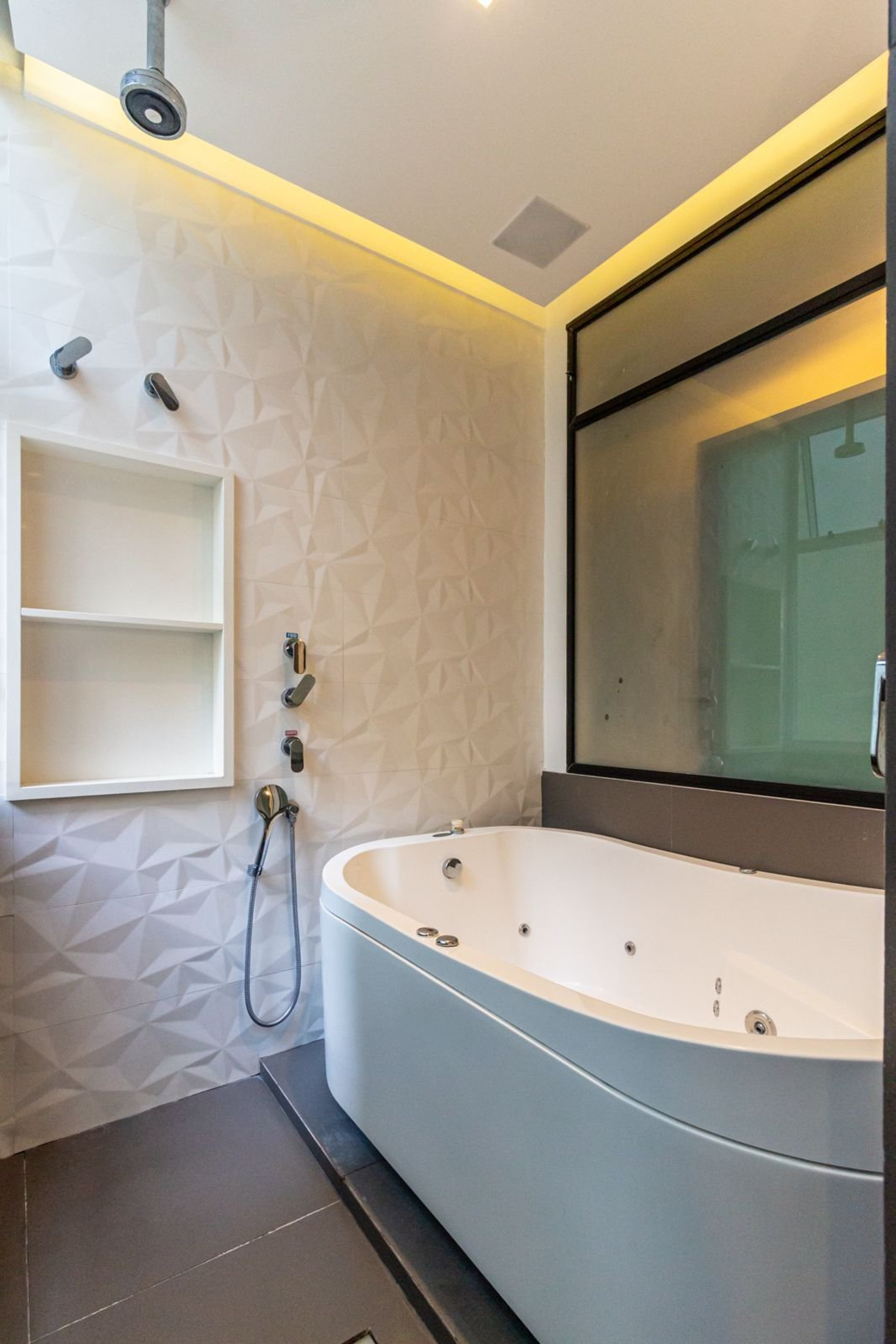 Luxury bathroom with jacuzzi and lighting