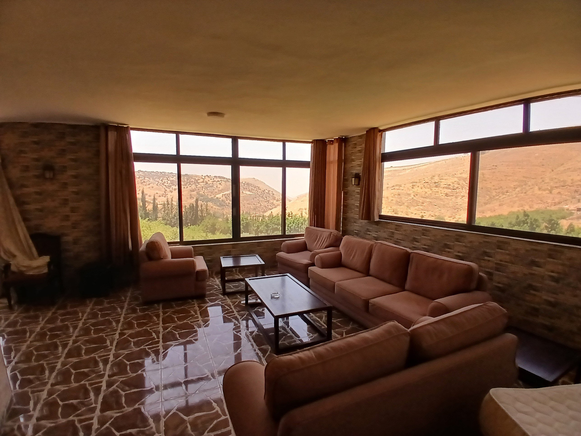 Living room sofas panoramic mountain view