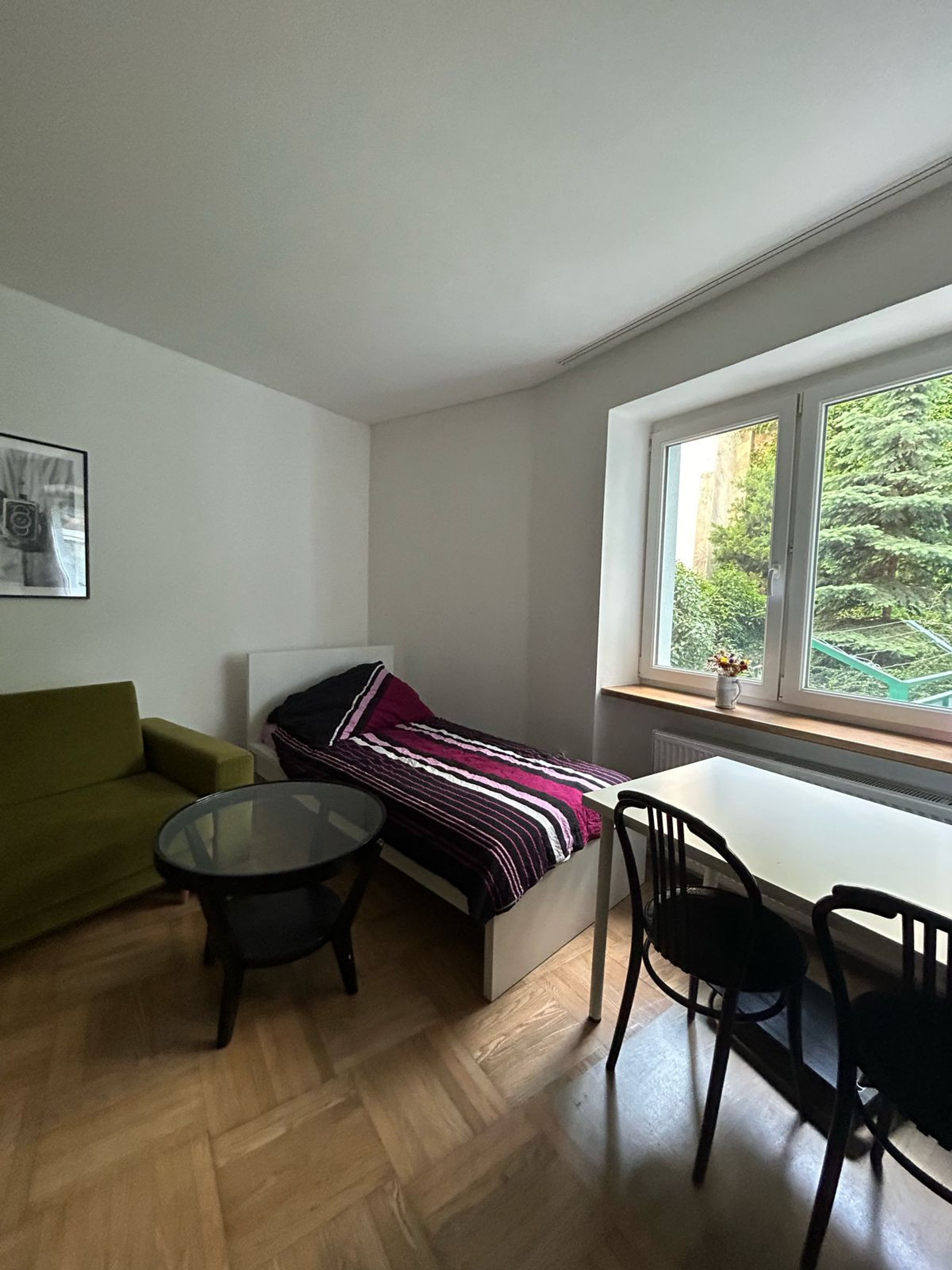 Single bed and table available in the room