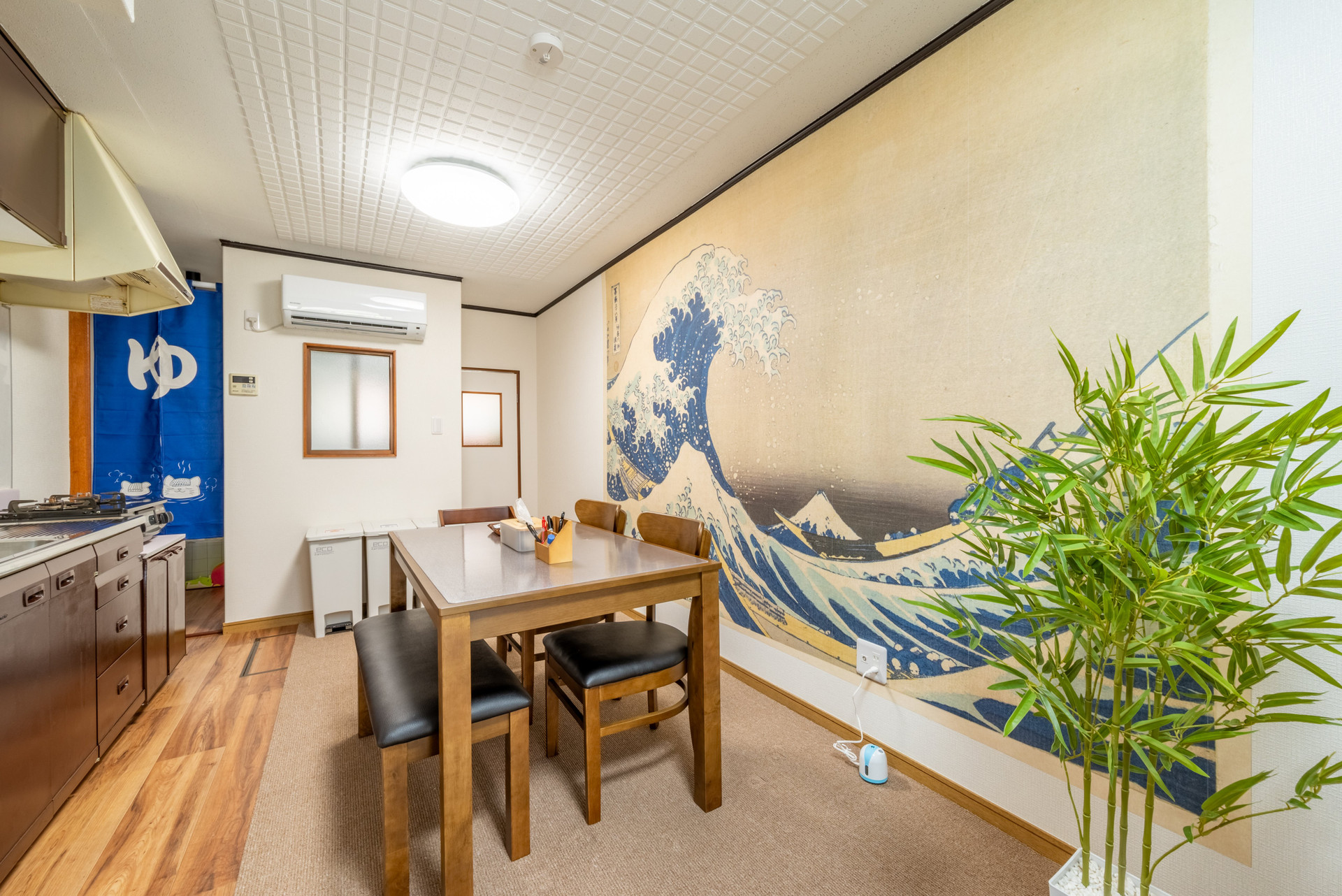 Dining area with Great Wave mural