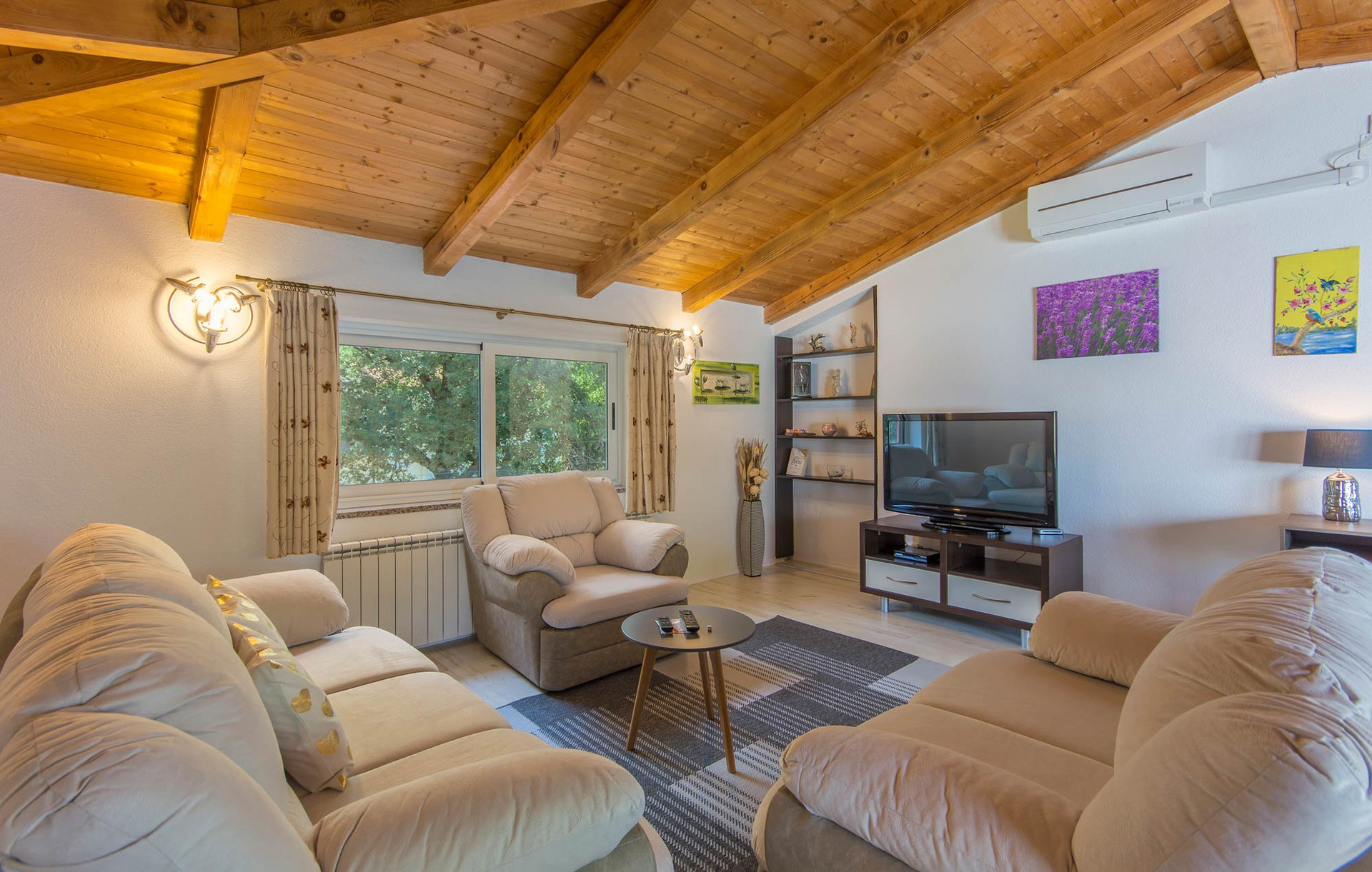 Bright living room with wooden ceiling