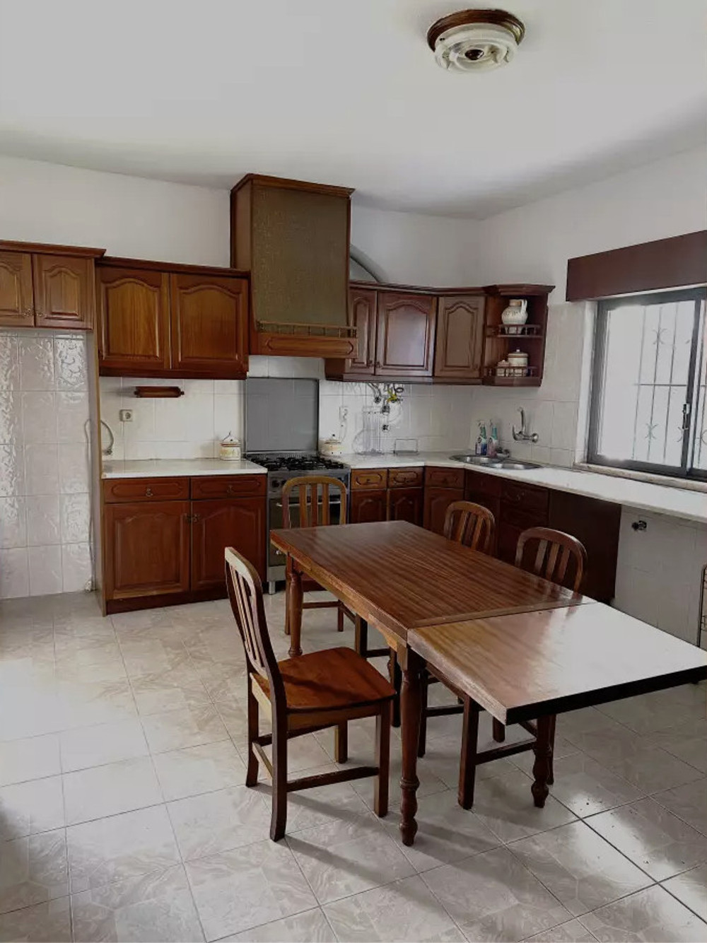 Room in a house with garden and barbecue