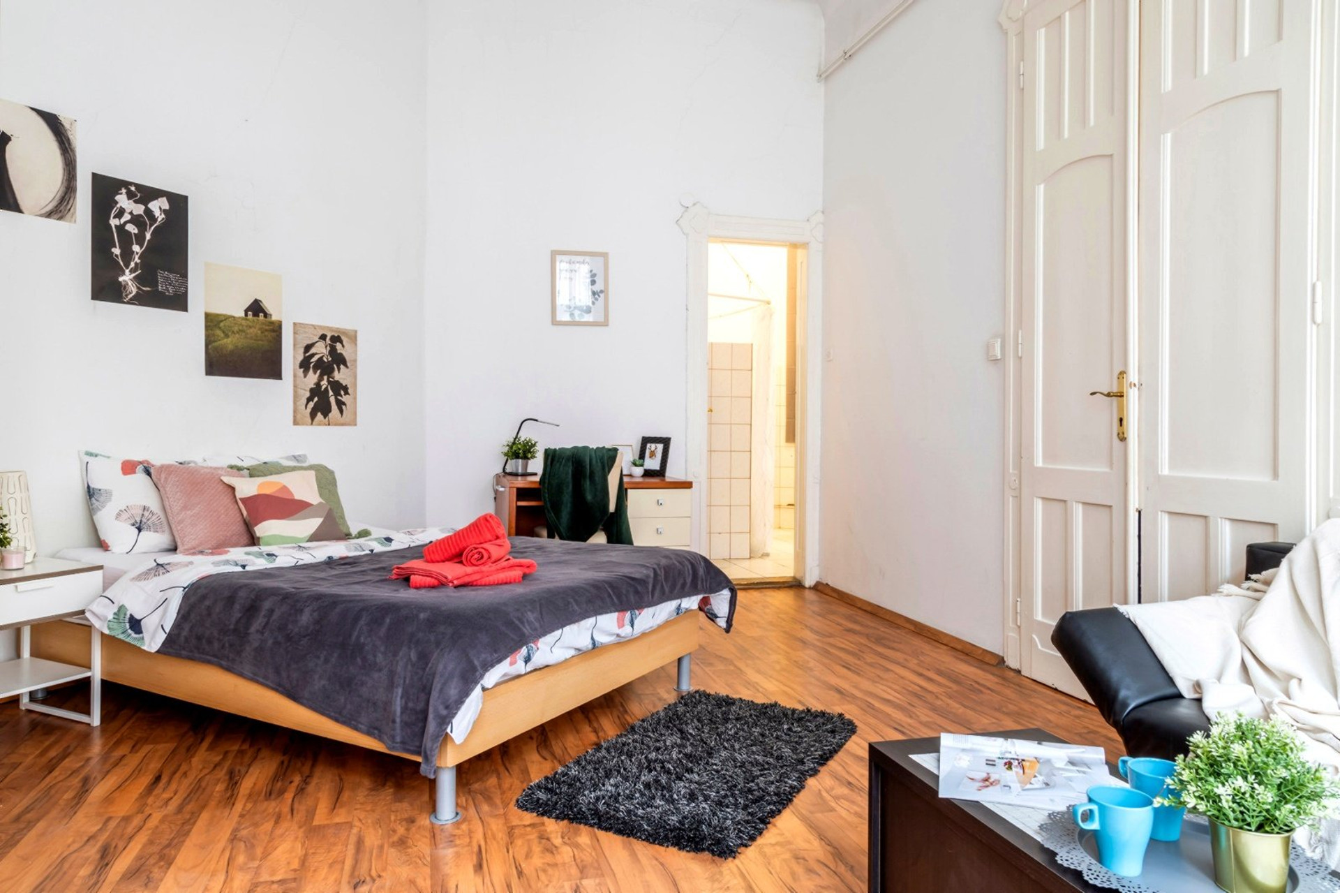Comfortable double bed in a high-ceiling historic apartment