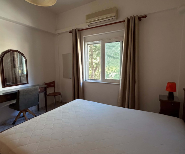 Bedroom with double bed and desk