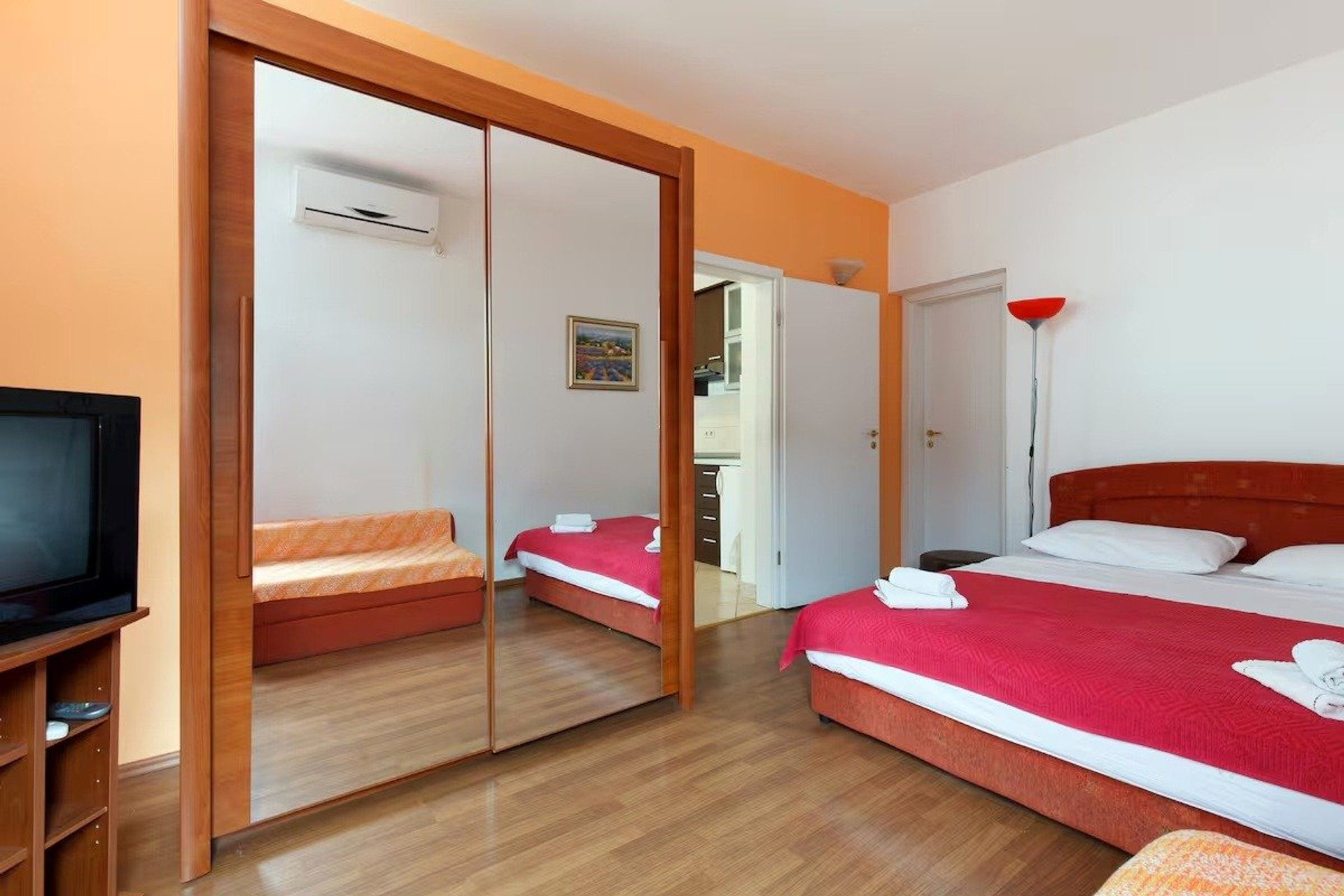 Bedroom with mirrored wardrobe