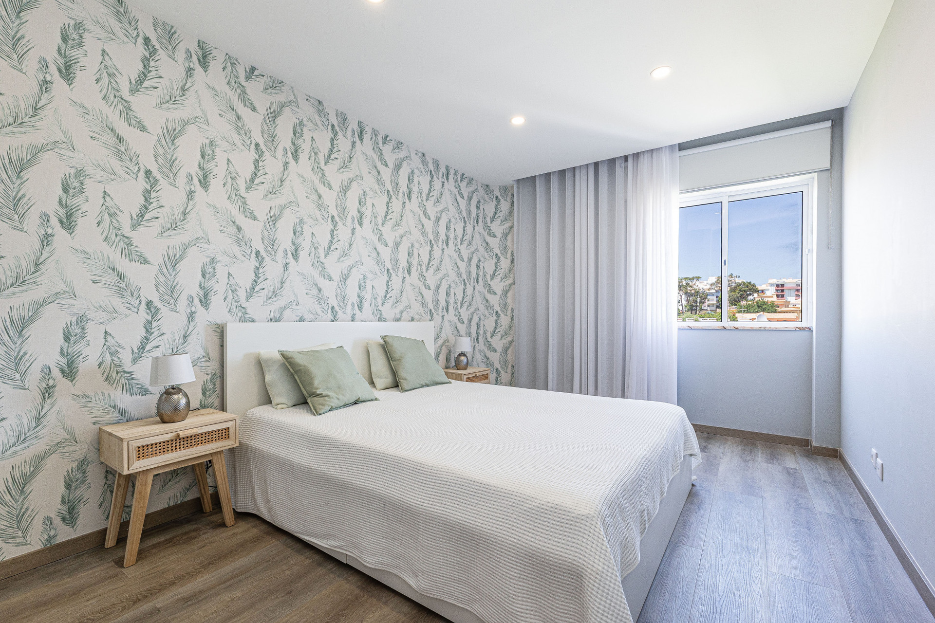 Bedroom with patterned wallpaper