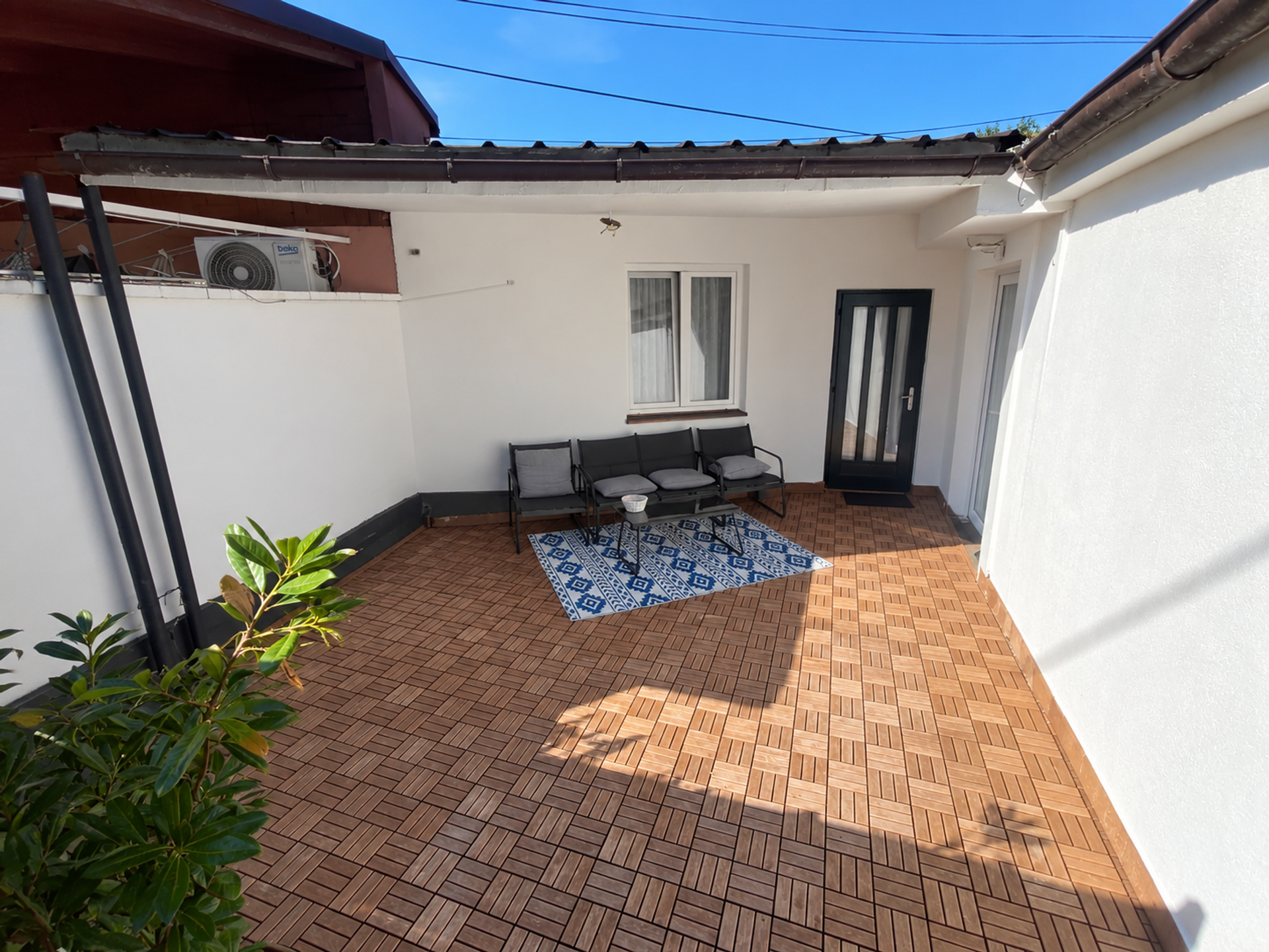 Sunny patio with lounge seating