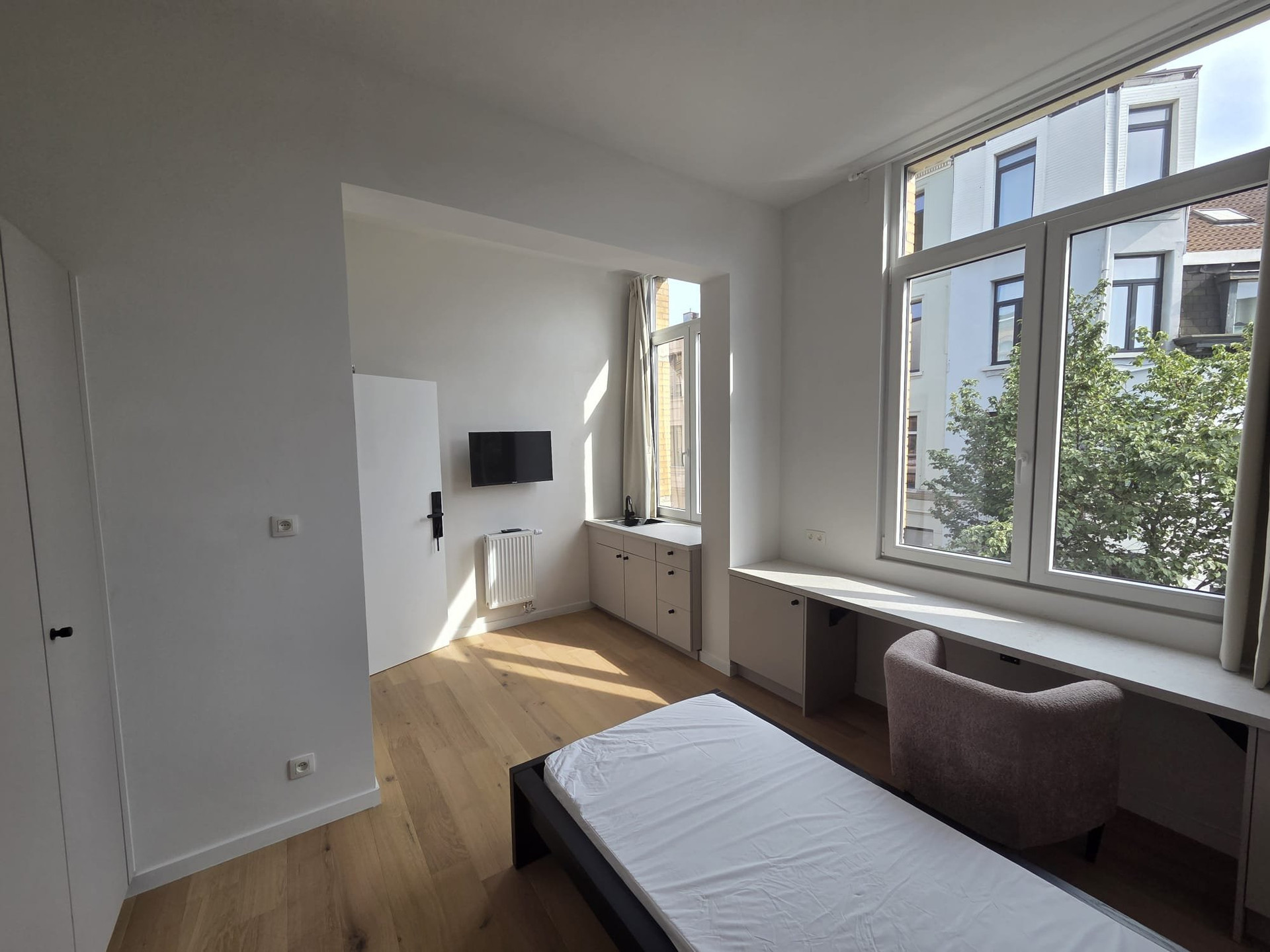 Bright bedroom with long desk