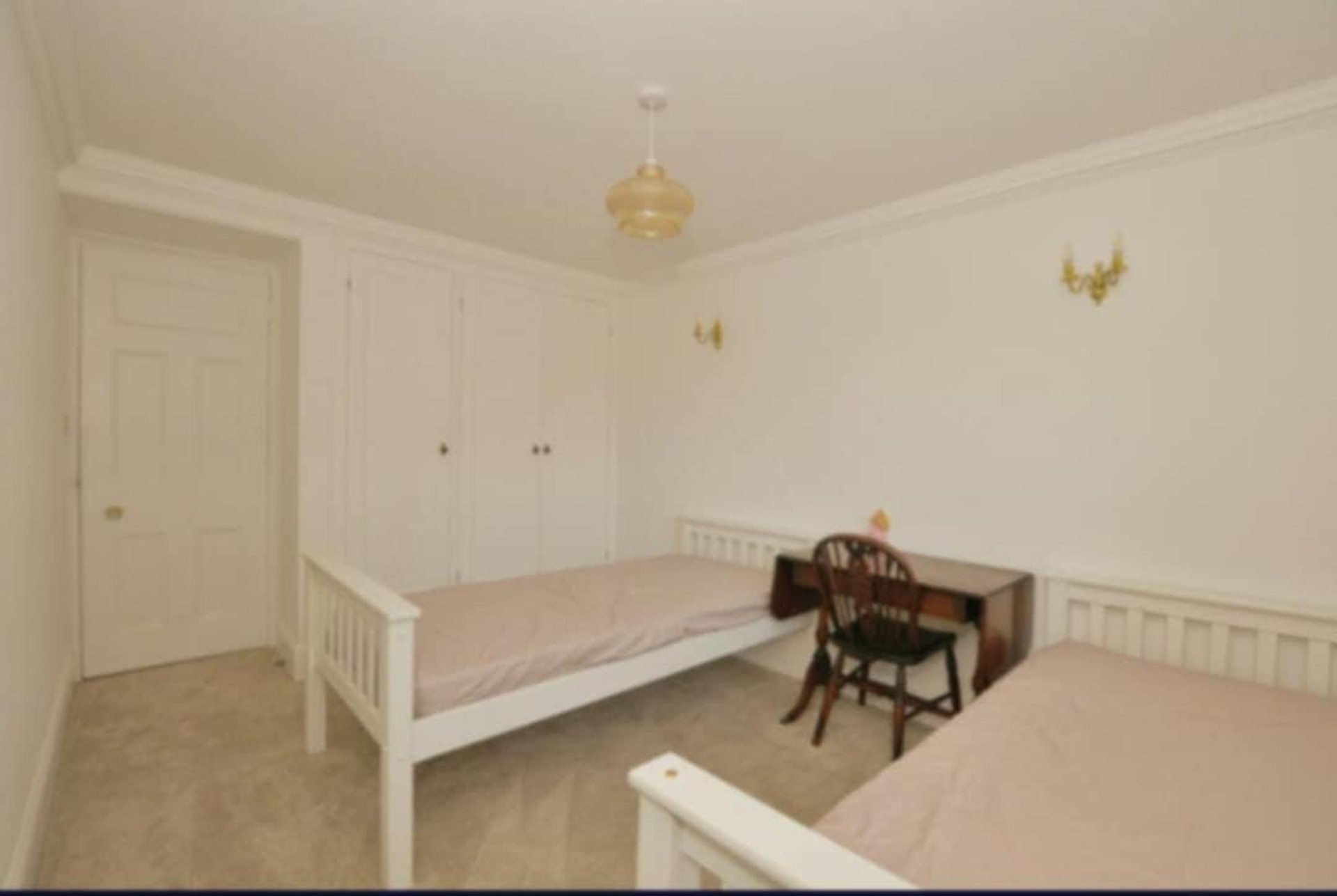 Twin bedroom with built-in wardrobes