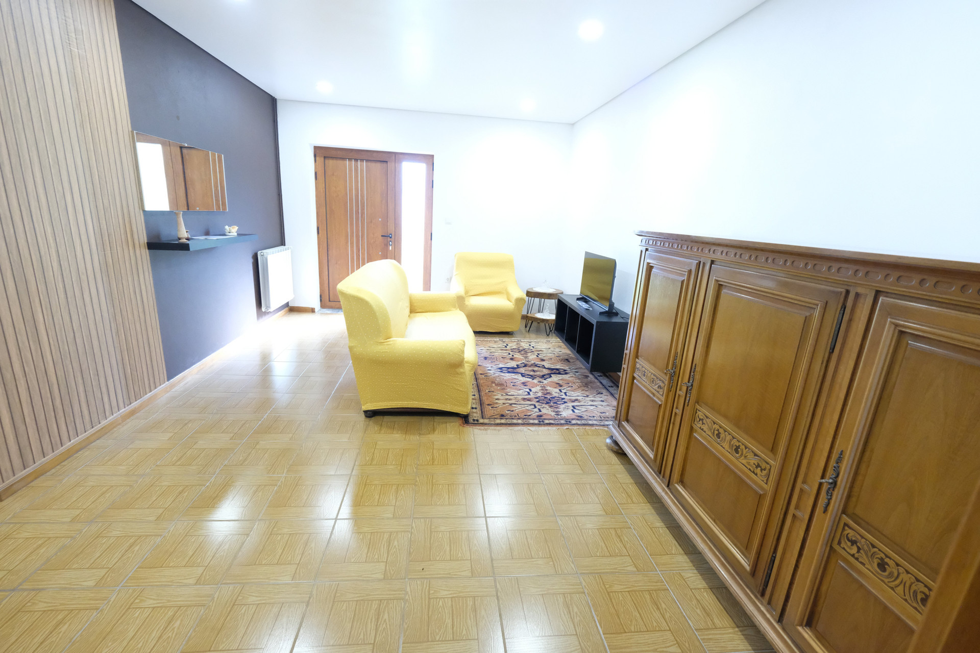 Living room with yellow armchairs