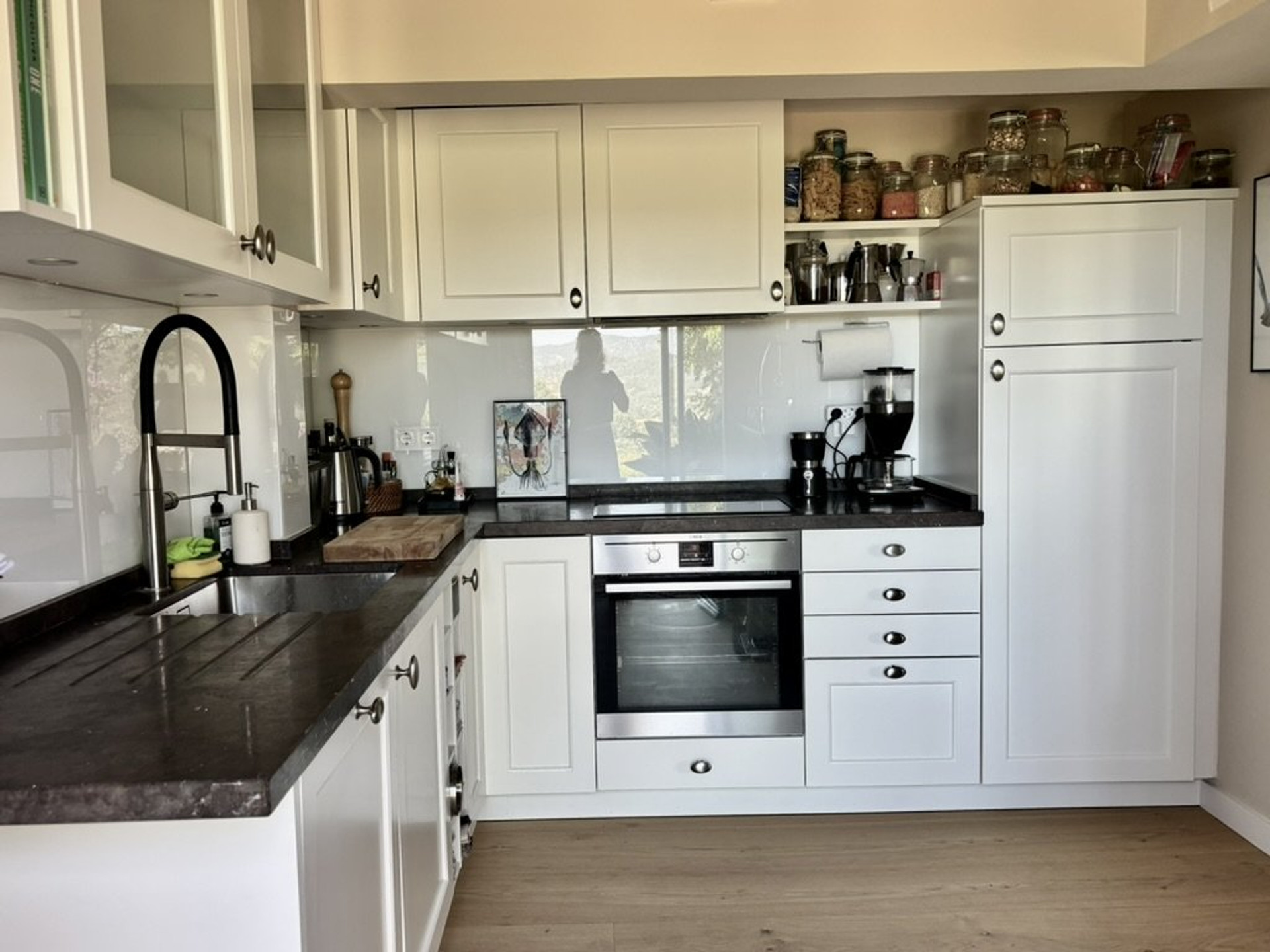 White kitchen with dark countertops