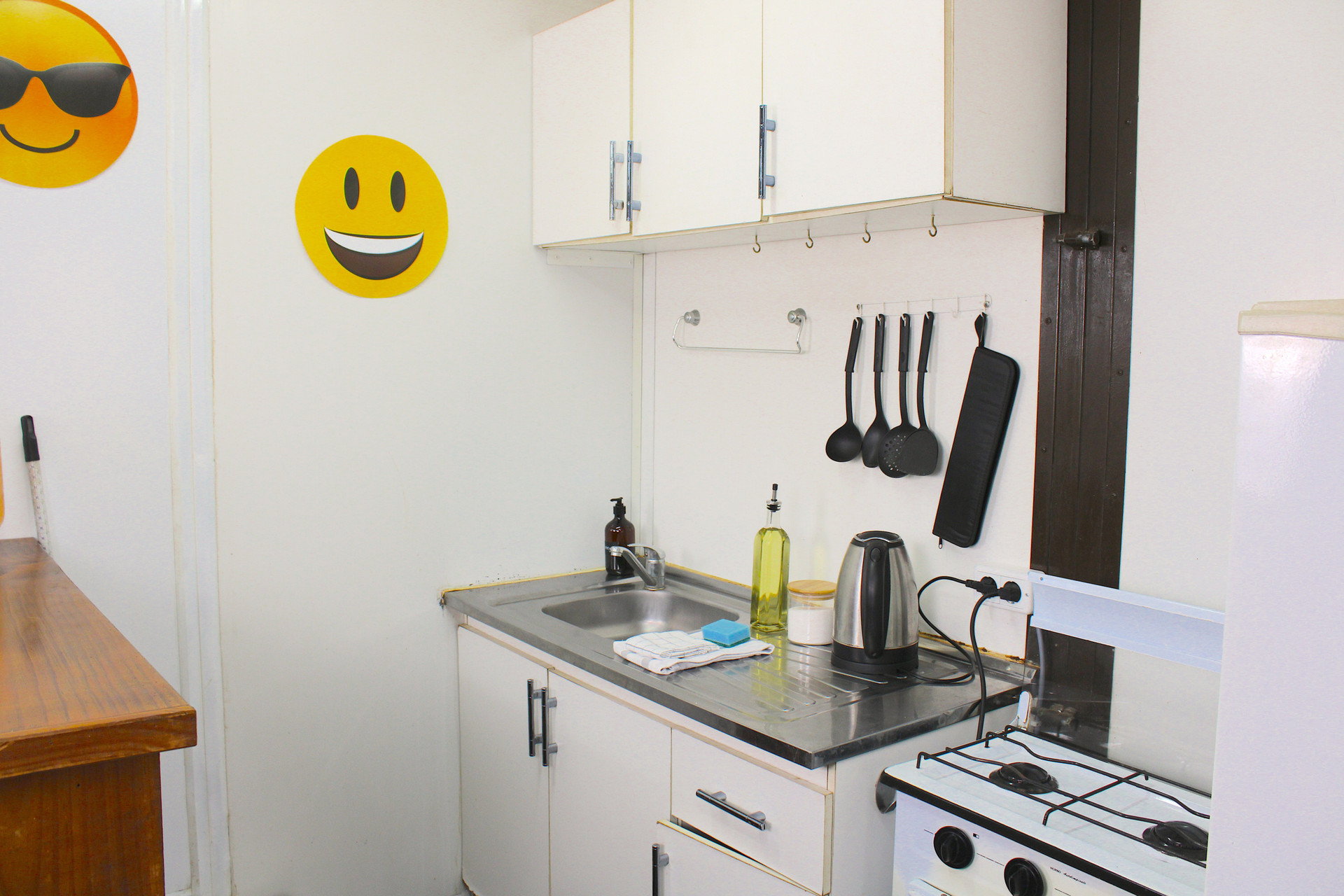Kitchen: gas stove, fridge, microwave, coffee maker and toaster