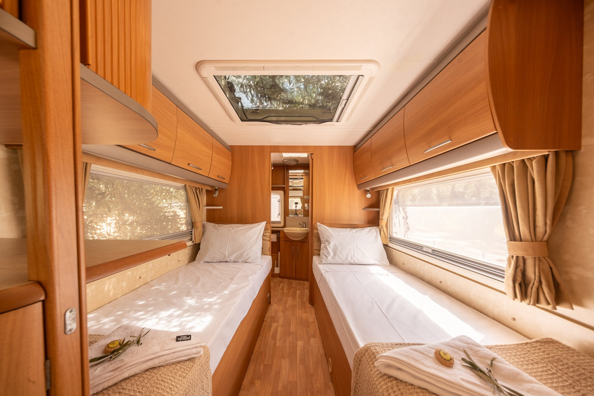 Twin bedroom with bathroom beyond
