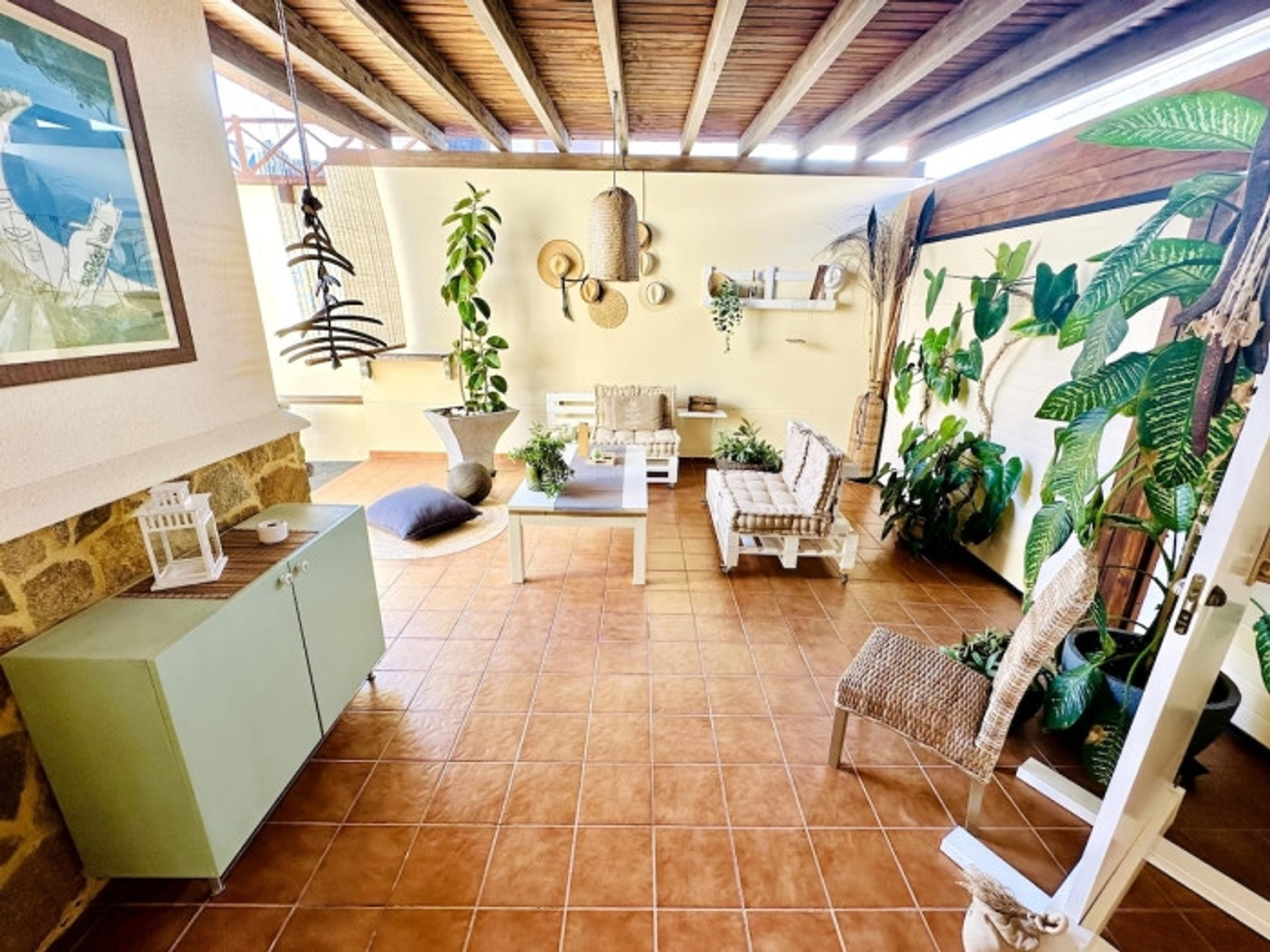 Covered terrace lounge with plants
