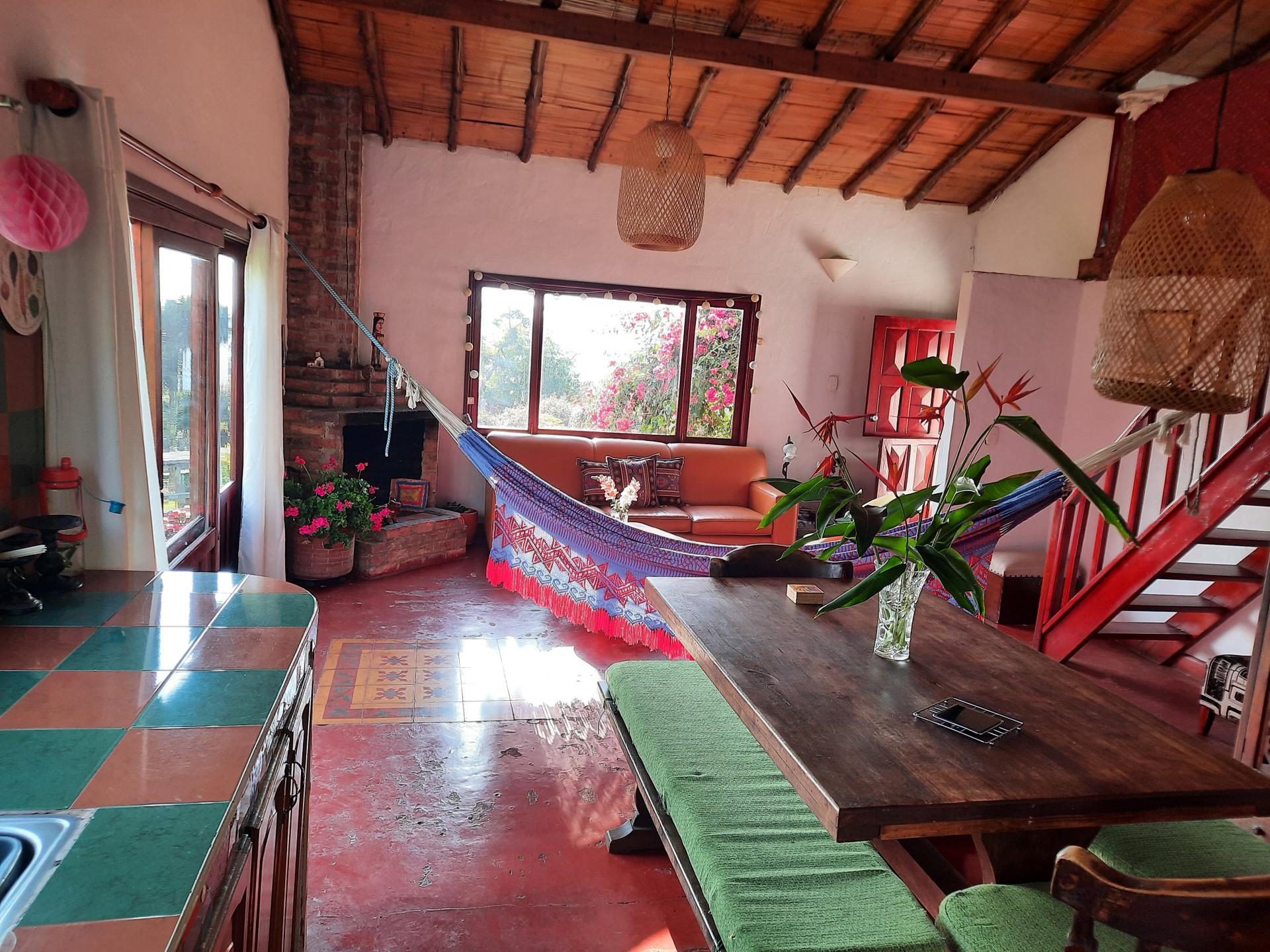 Living romm with fireplace and dining room with a view