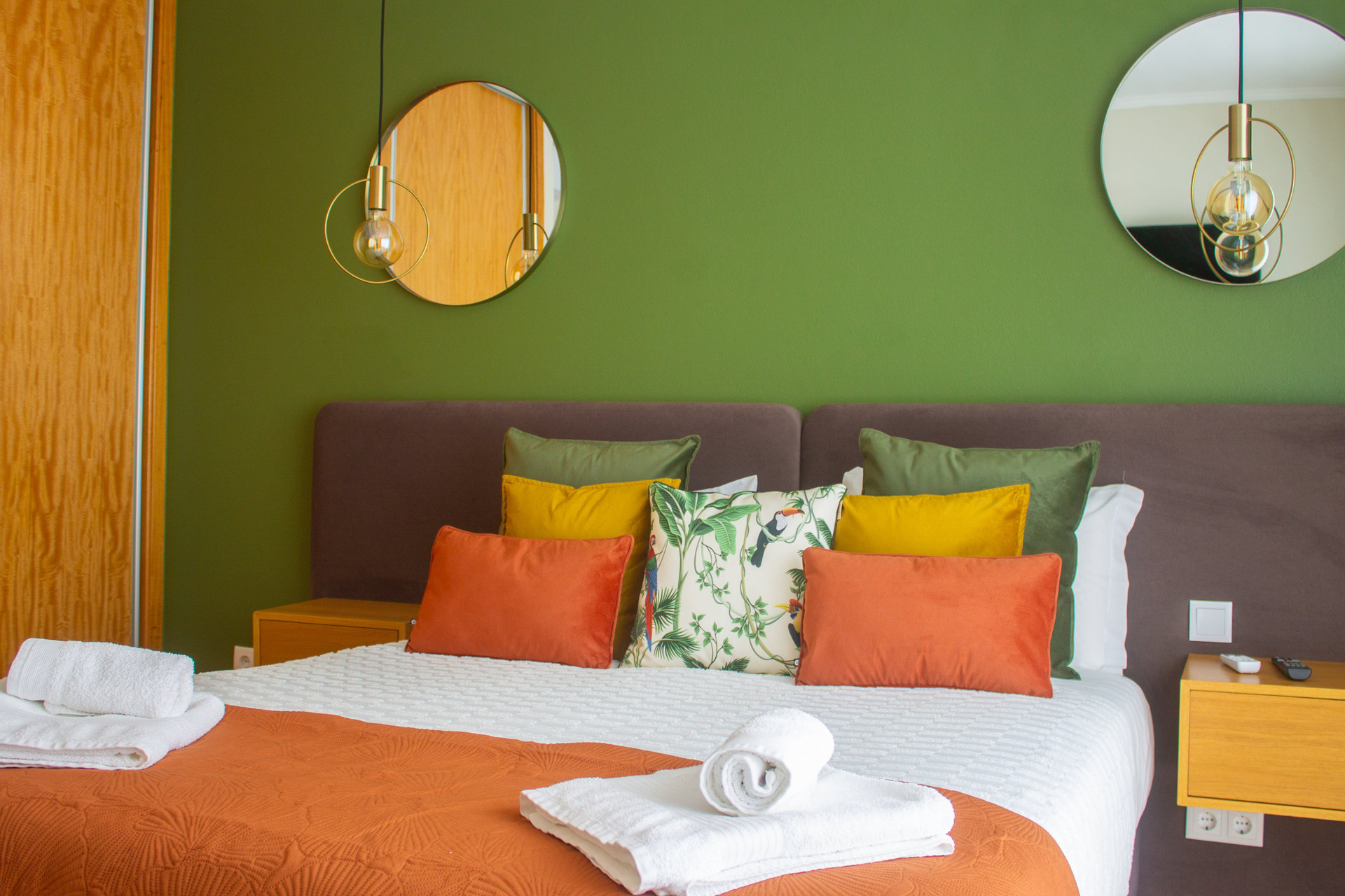 Green bedroom with mirrors