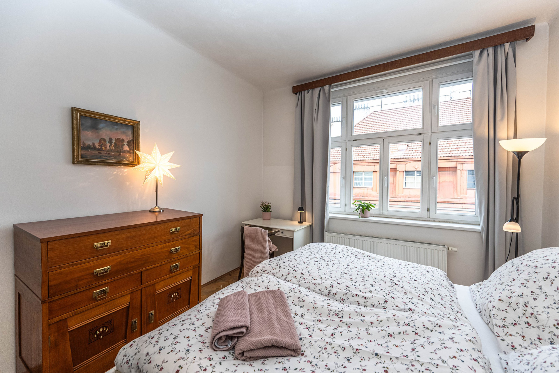 Bedroom with dresser and window