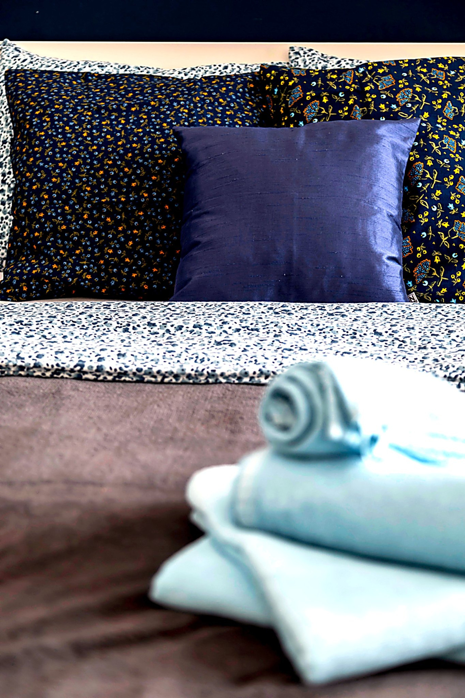 Comfortable bed with fresh bed linen, designed to provide a relaxing and restful stay.