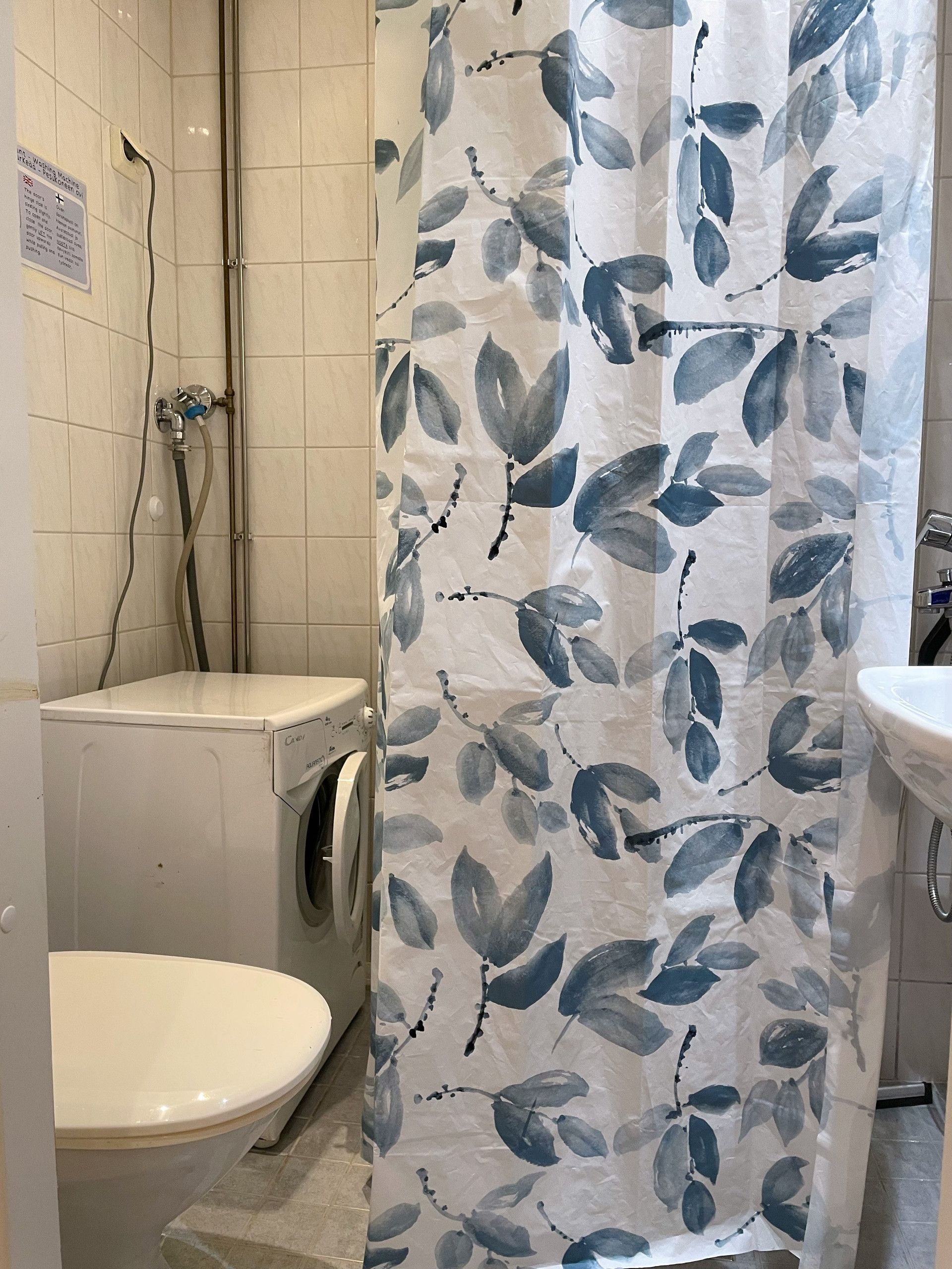 Bathroom with shower and washer