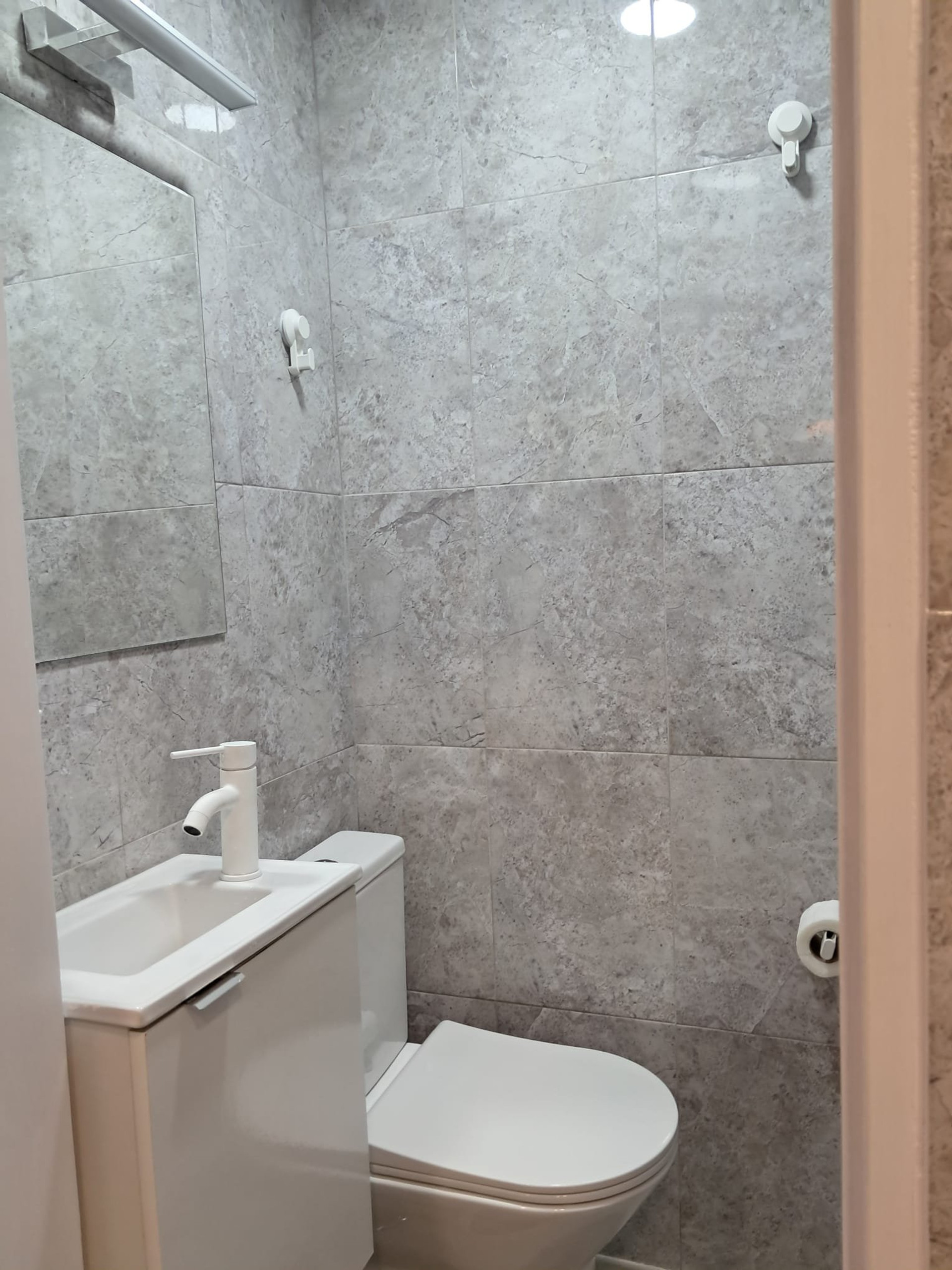 Modern bathroom with grey marble tiles