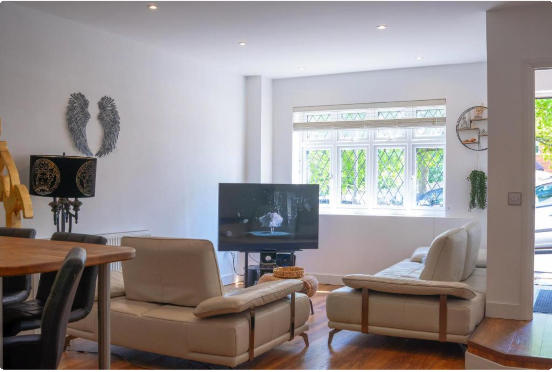 Bright living area with sofas and TV