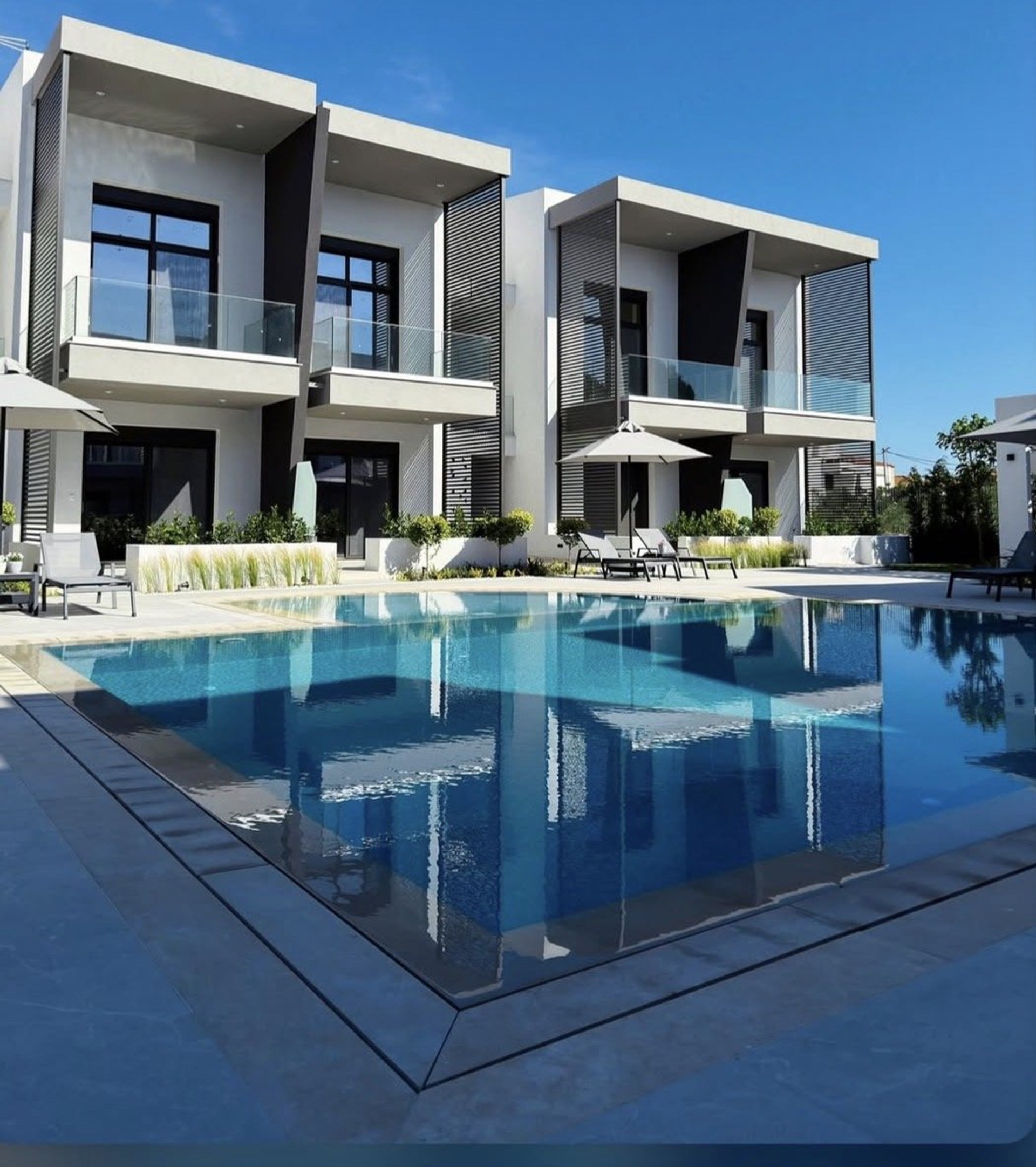 Modern building with large shared pool