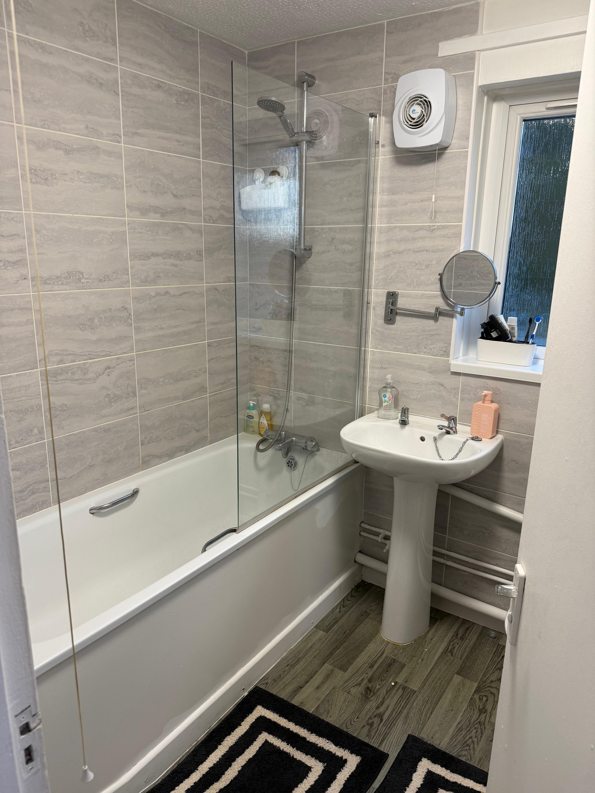Bathroom with tub and sink