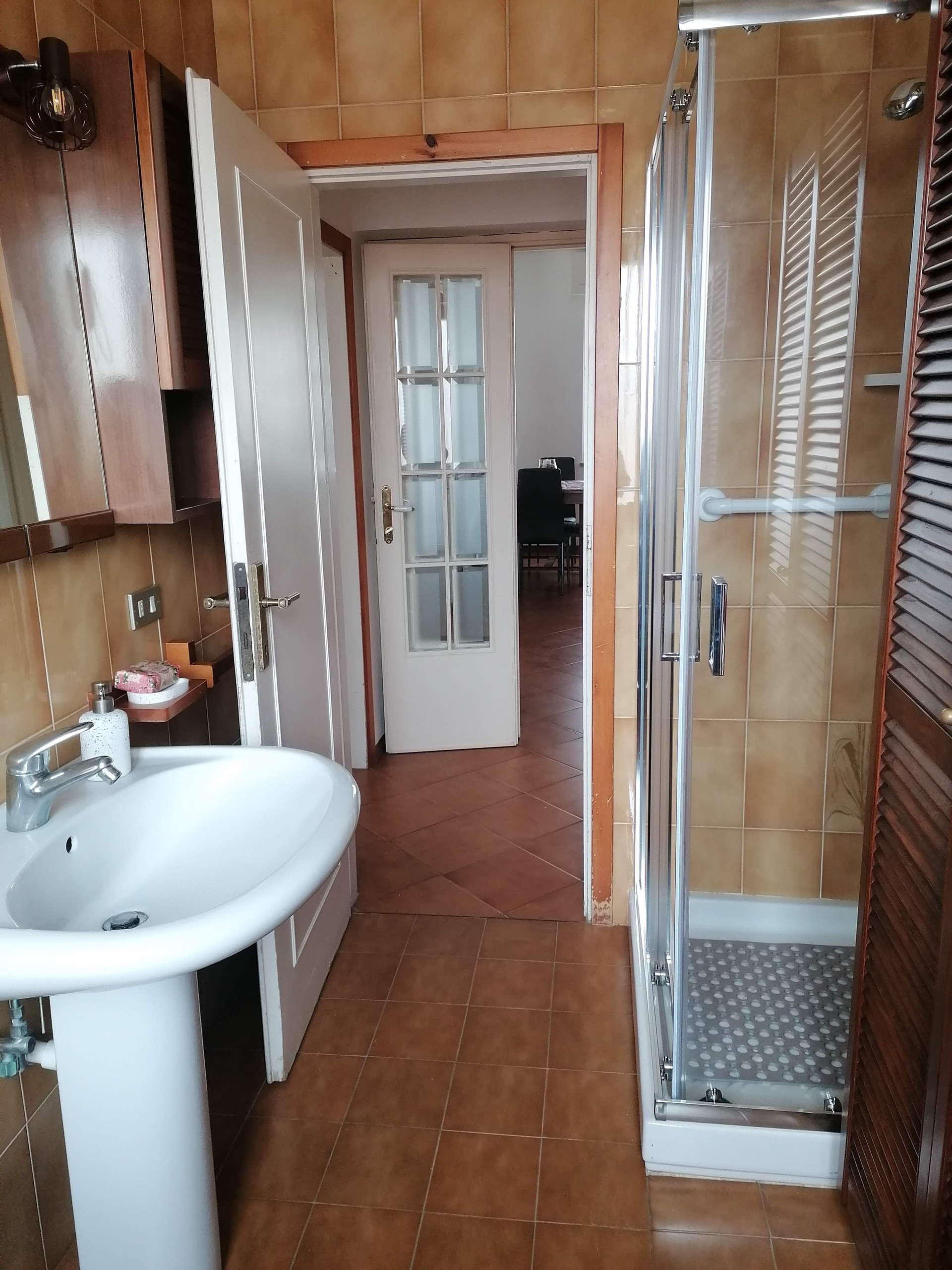 Bathroom with shower and sink