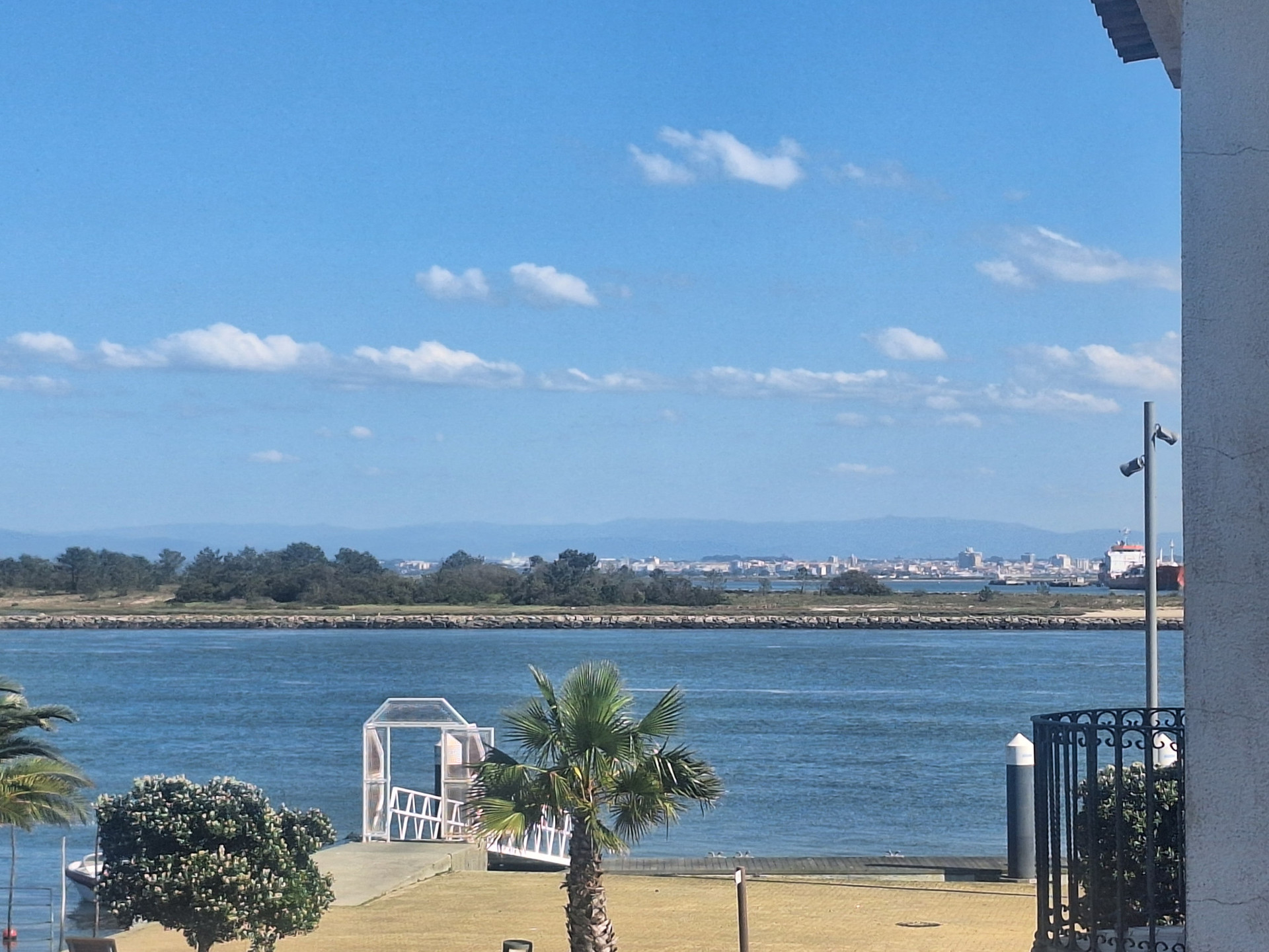 Balcony view from Apartment B in Casa dos Jacintos across the Aveiro lagoon (Ria de Aveiro), with downtown Aveiro in the background. 