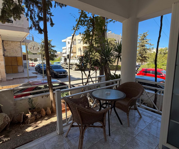 Balcony with wicker table and chairs