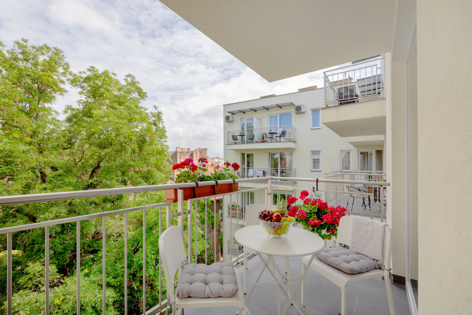 Balcony with table and flowers