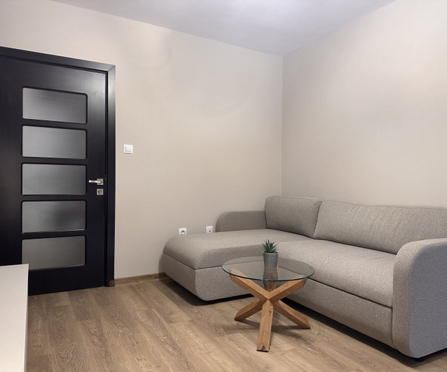 Living room with sofa and door