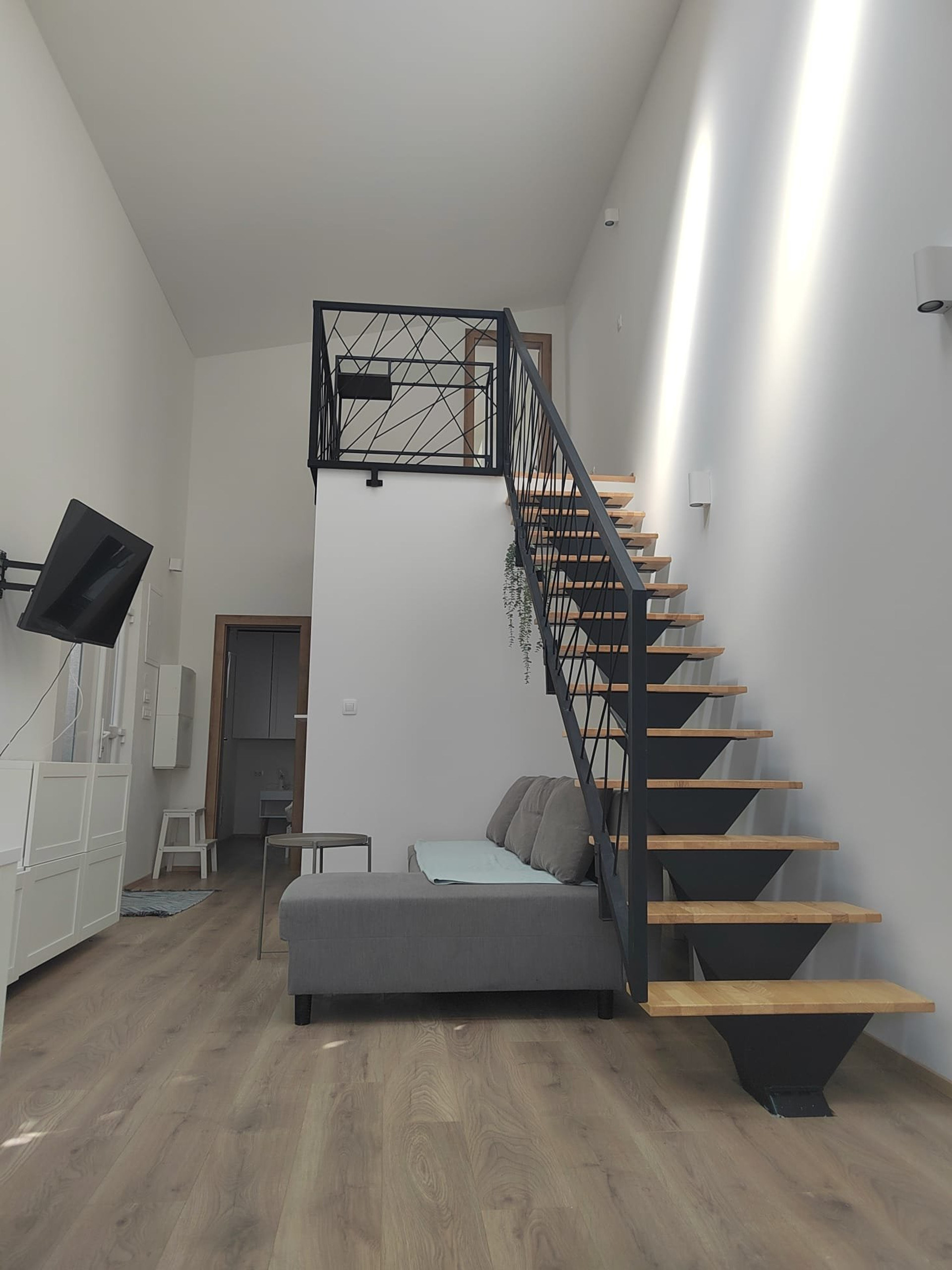 Living room with staircase to loft
