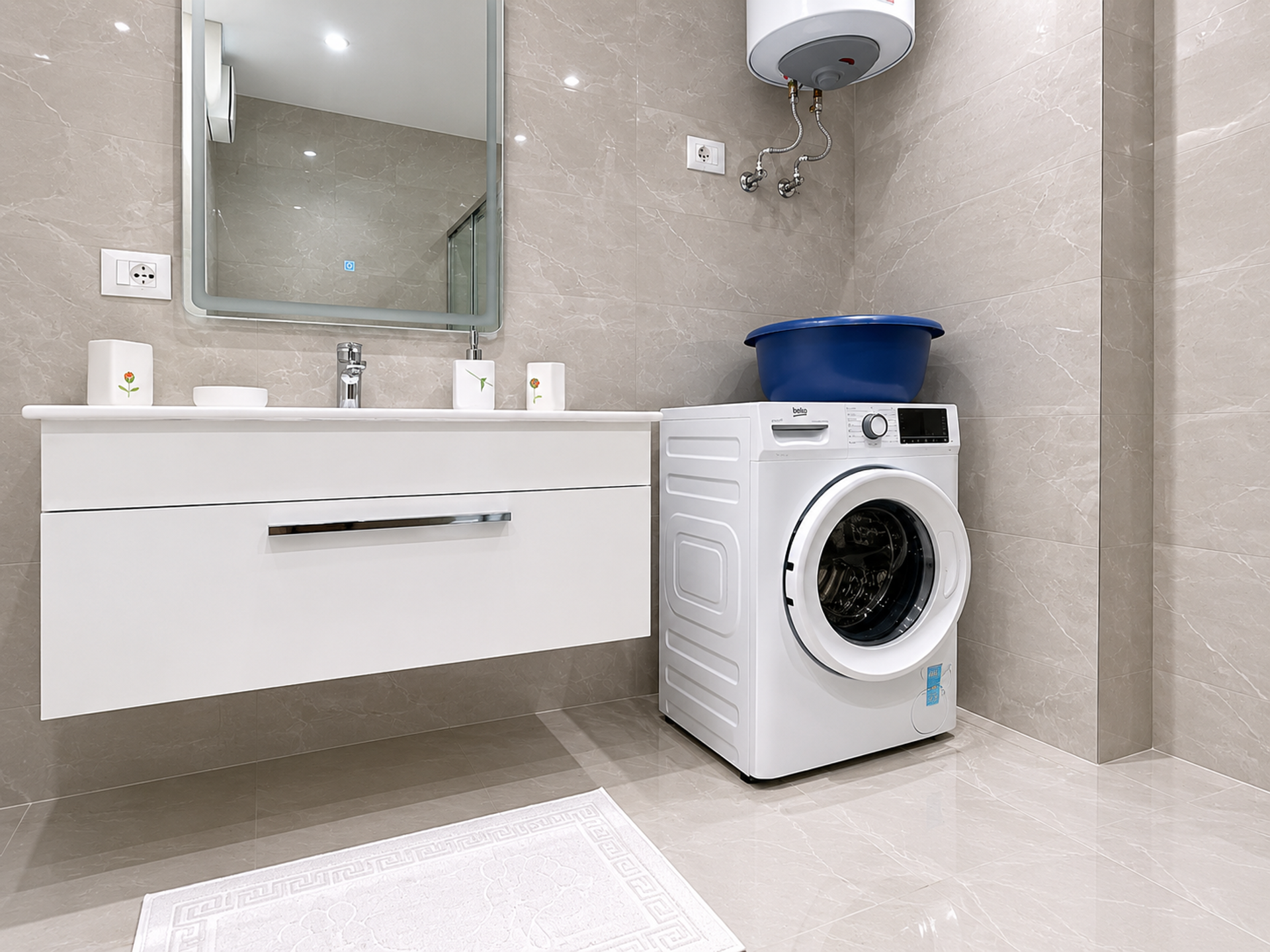 Bathroom with washing machine and vanity