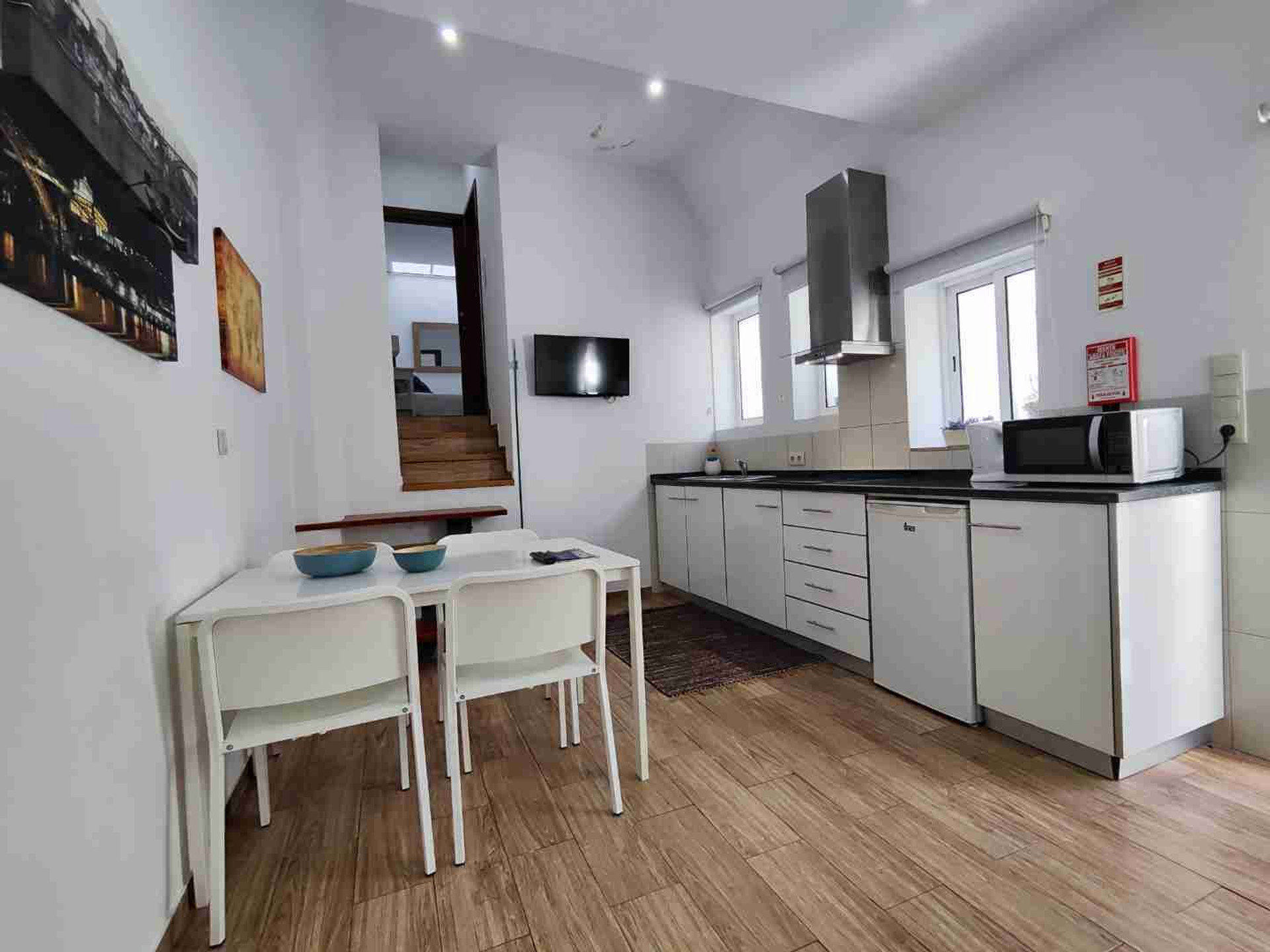 Kitchen with dining table and stairs