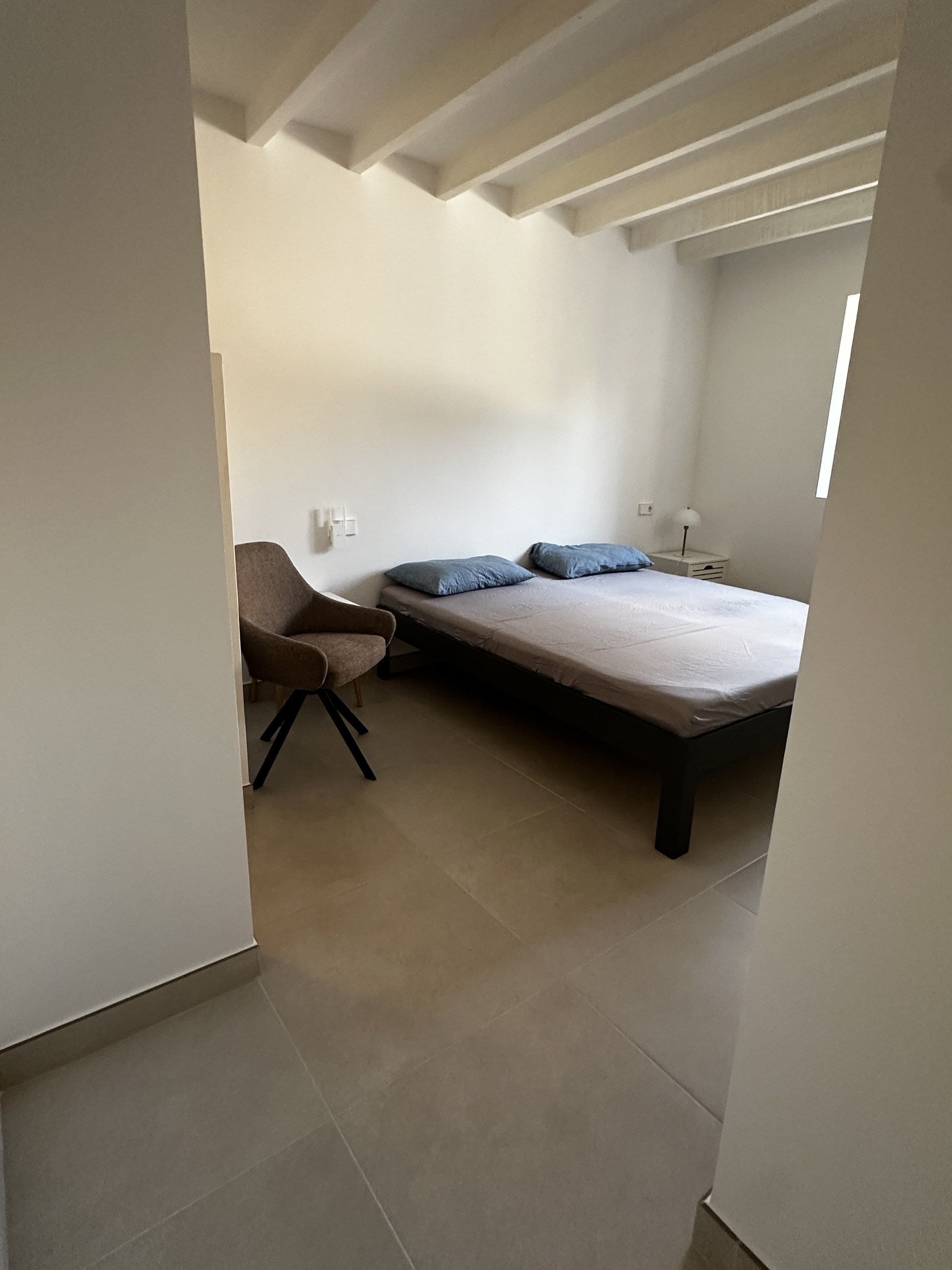 Bedroom with bed and chair