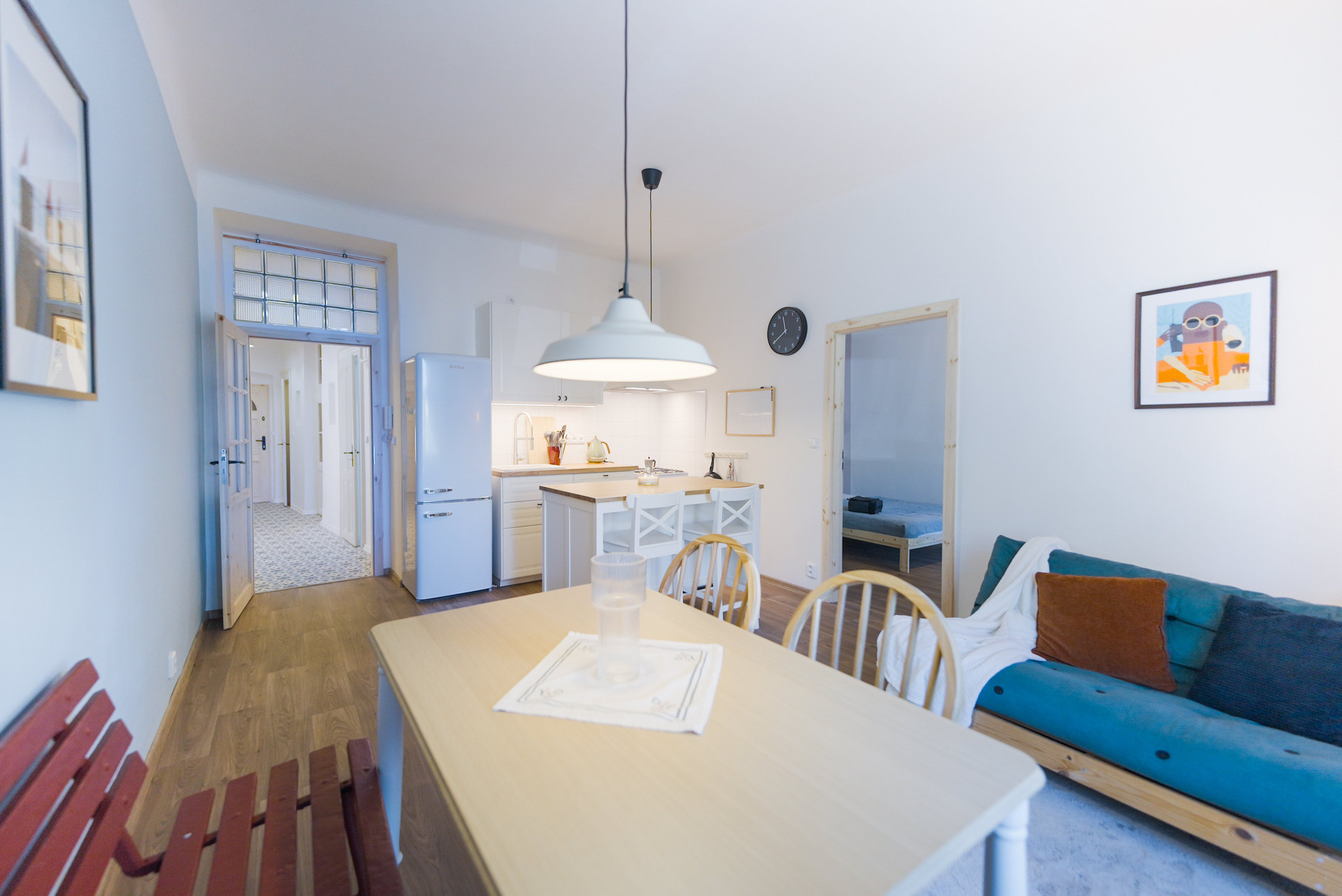 Living area with kitchen and sofa